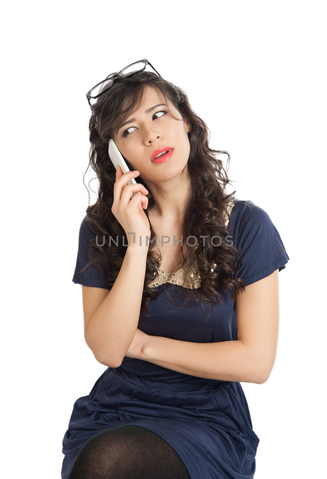 Woman in glasses emotionally speaks on a mobile phone