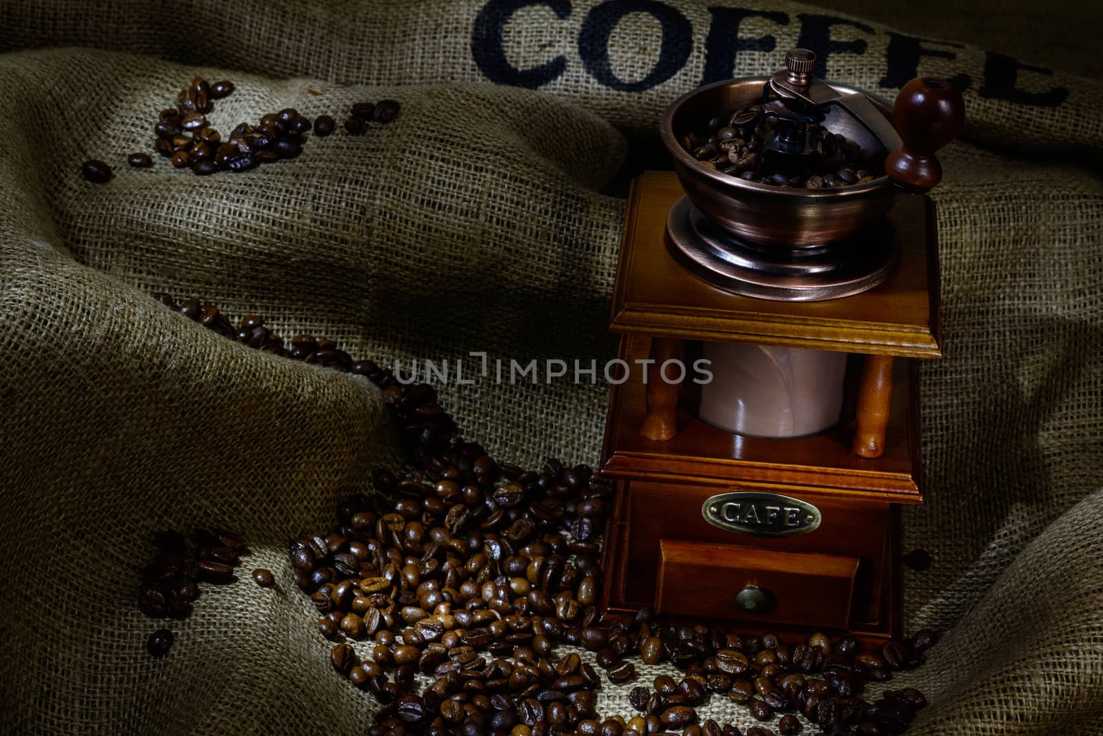 Coffee Mill with beans and burlap. still life