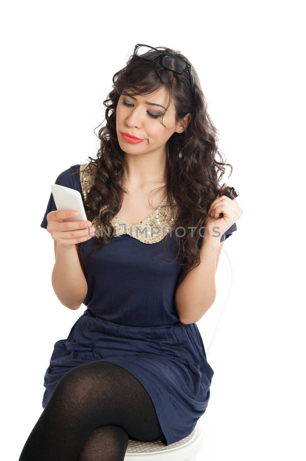 Woman in glasses emotionally speaks on a mobile phone