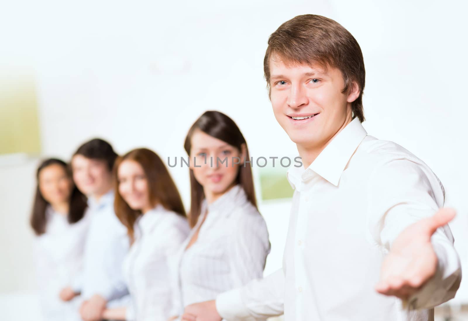 group of people holding hands, man holds out his hand, the concept of teamwork
