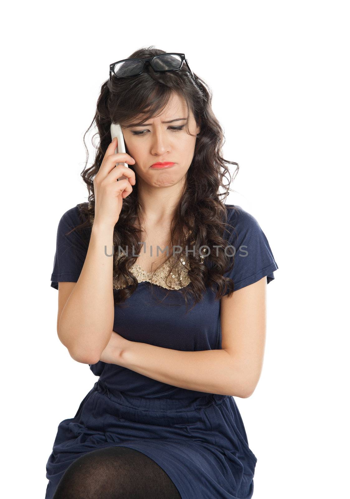 Woman in glasses emotionally speaks on a mobile phone