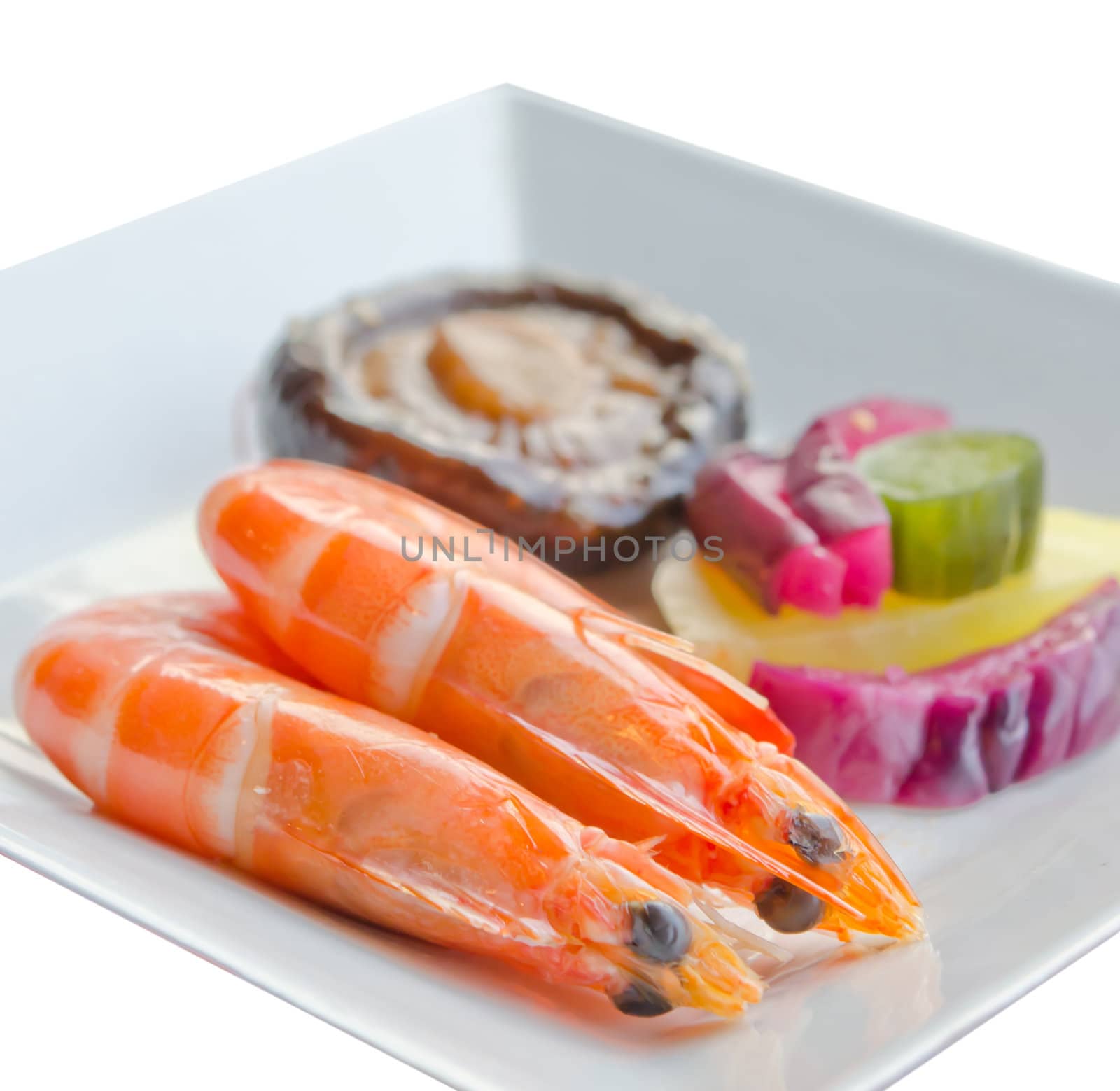 boiled shrimps with pickled vegetable and mushroom on white  plate, white background