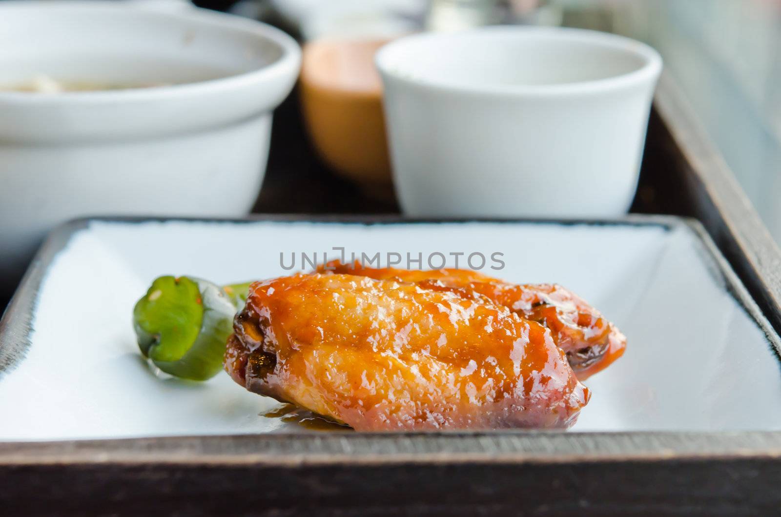 Fried Chicken Wings with sweet sauce  on dish