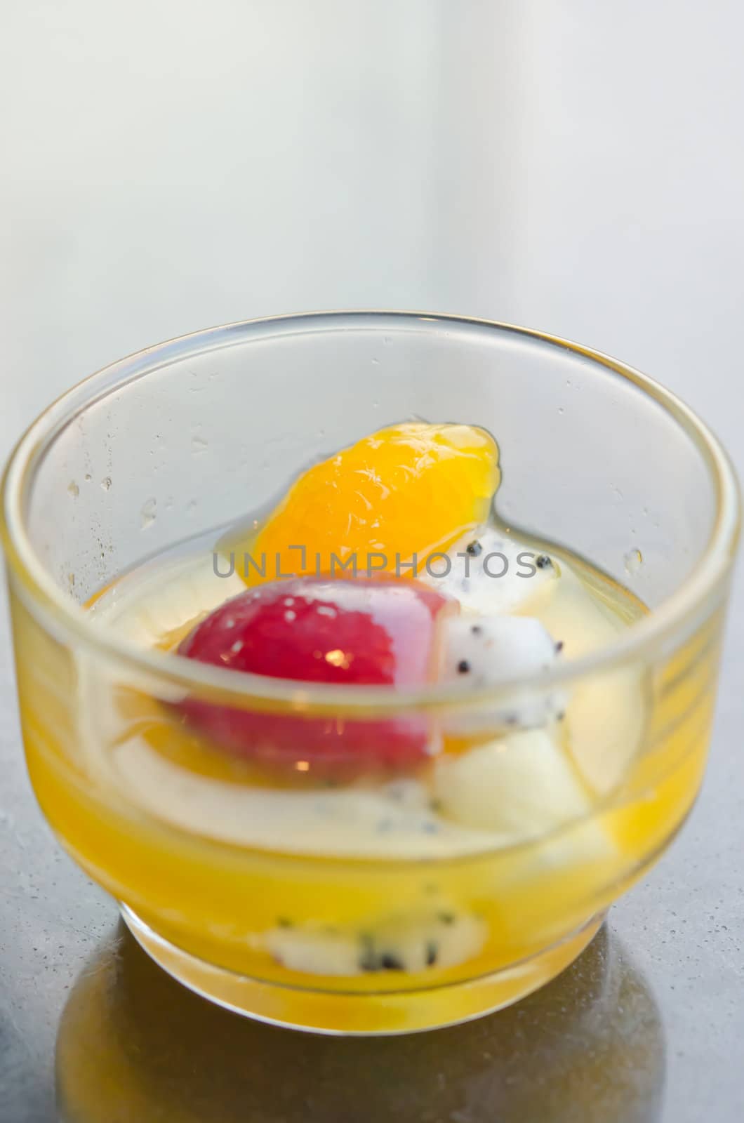 mix fruits in glass on table , sweet dessert