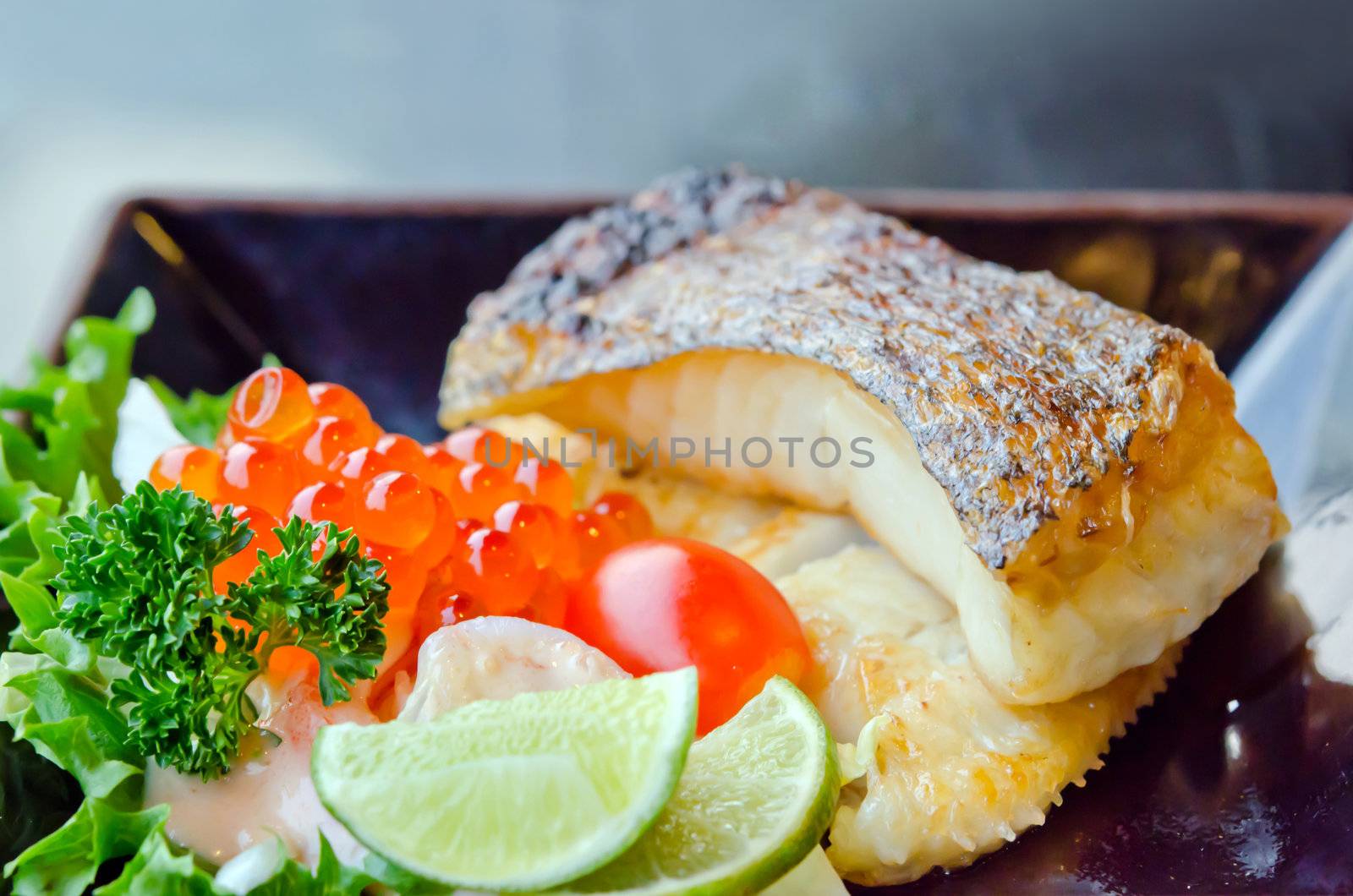  fresh salad with fish egg  and Japanese grilled cod fish  on dish