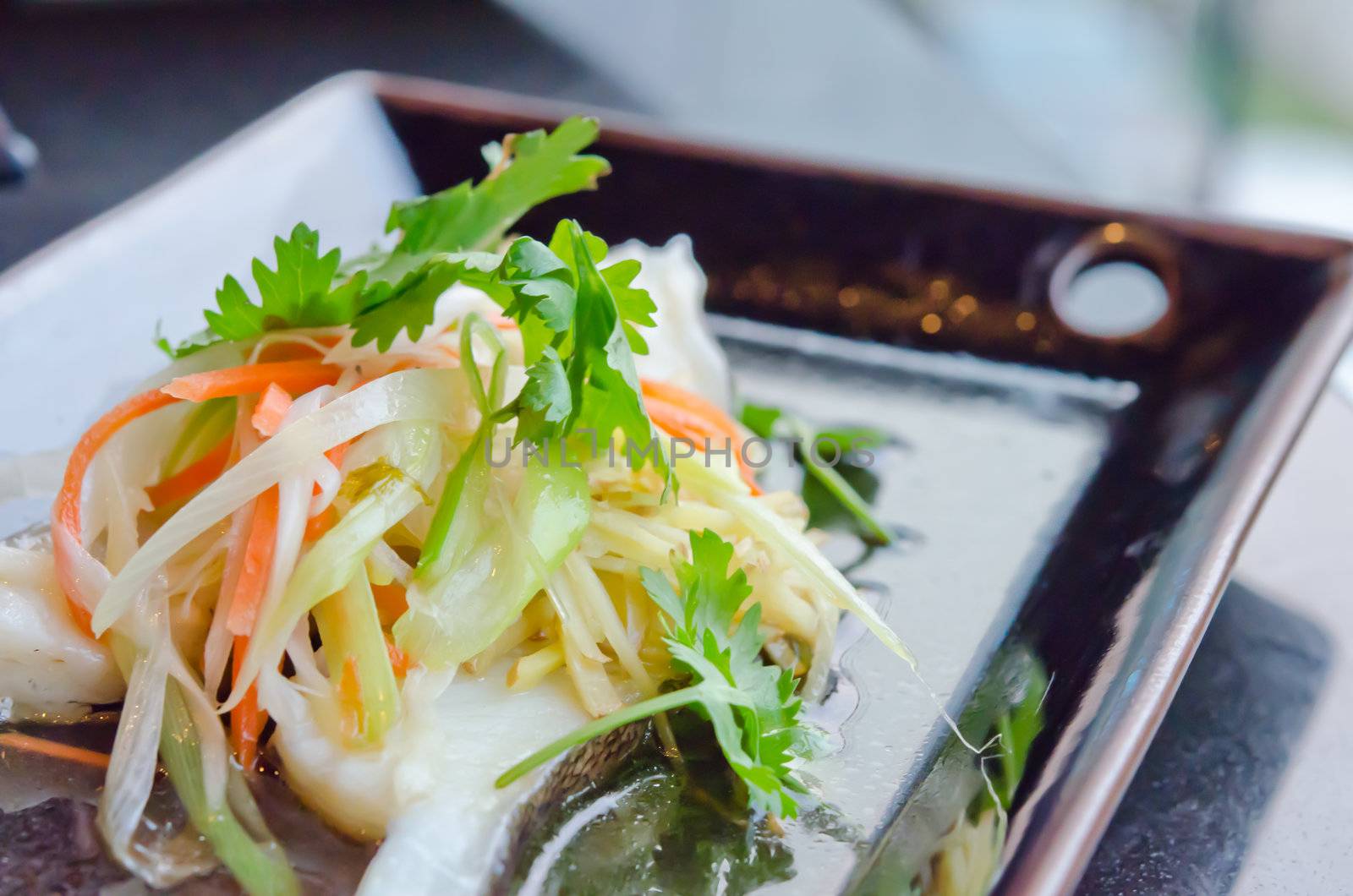 steamed white fish with  vegetable  on dish