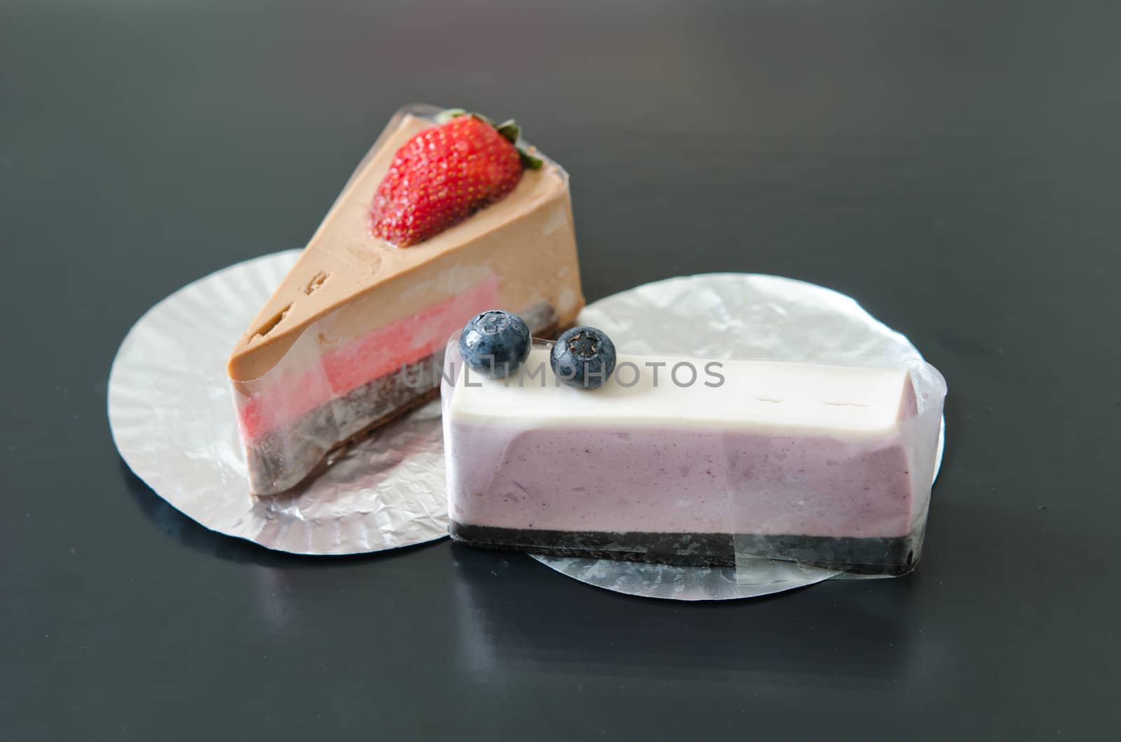 blueberries cheesecake and strawberry cheesecake , sweet dessert