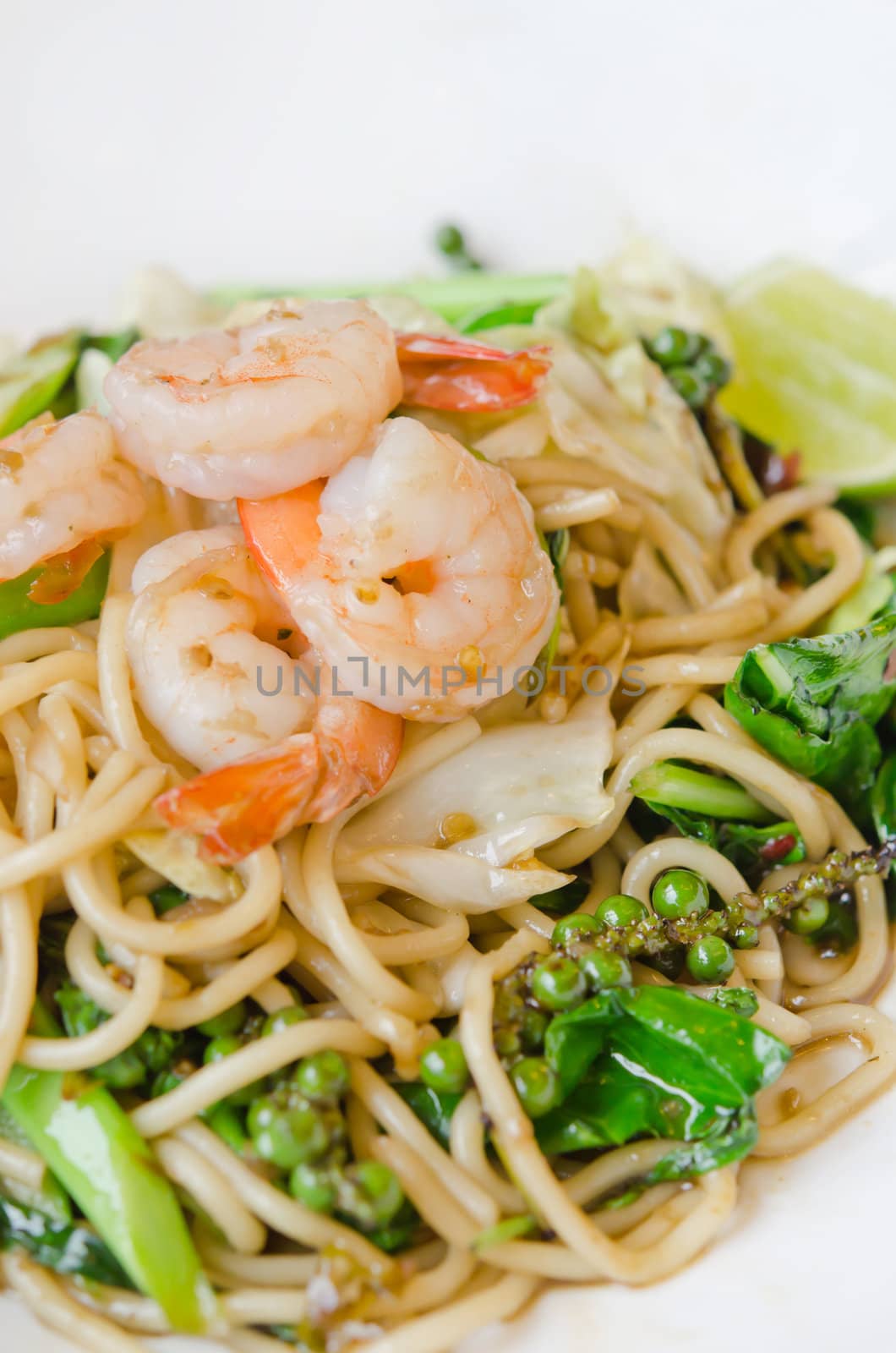 close up of Spaghetti with spicy prawn on white dish