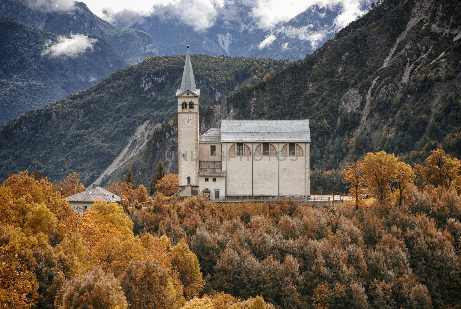 Lonely church in the Italian Alps at fall.
