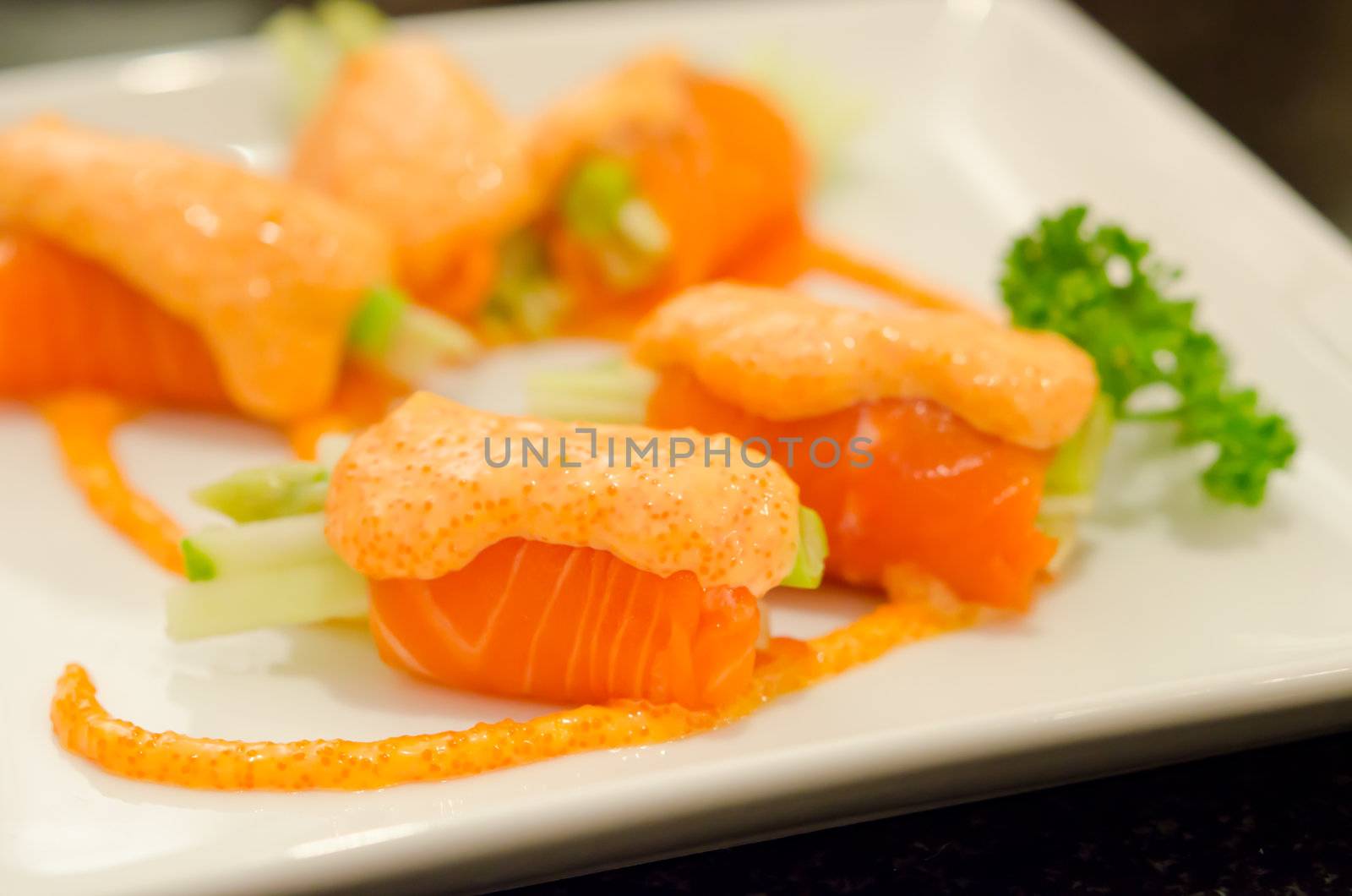 salmon rolls with vegetable on  plate  , seafood dish , asian food
