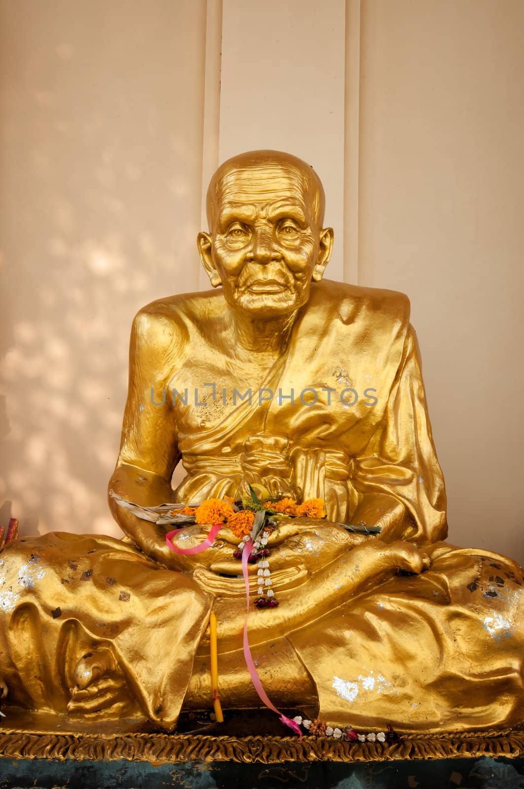 Gold buddhist monk statue by johnnychaos