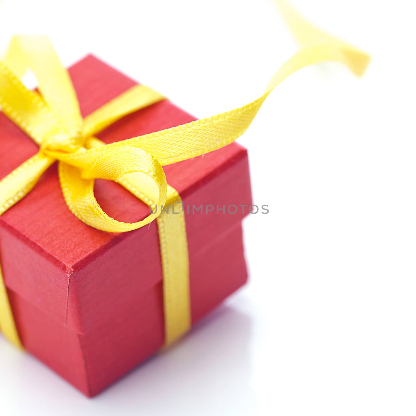red gift box isolated on white by jannyjus