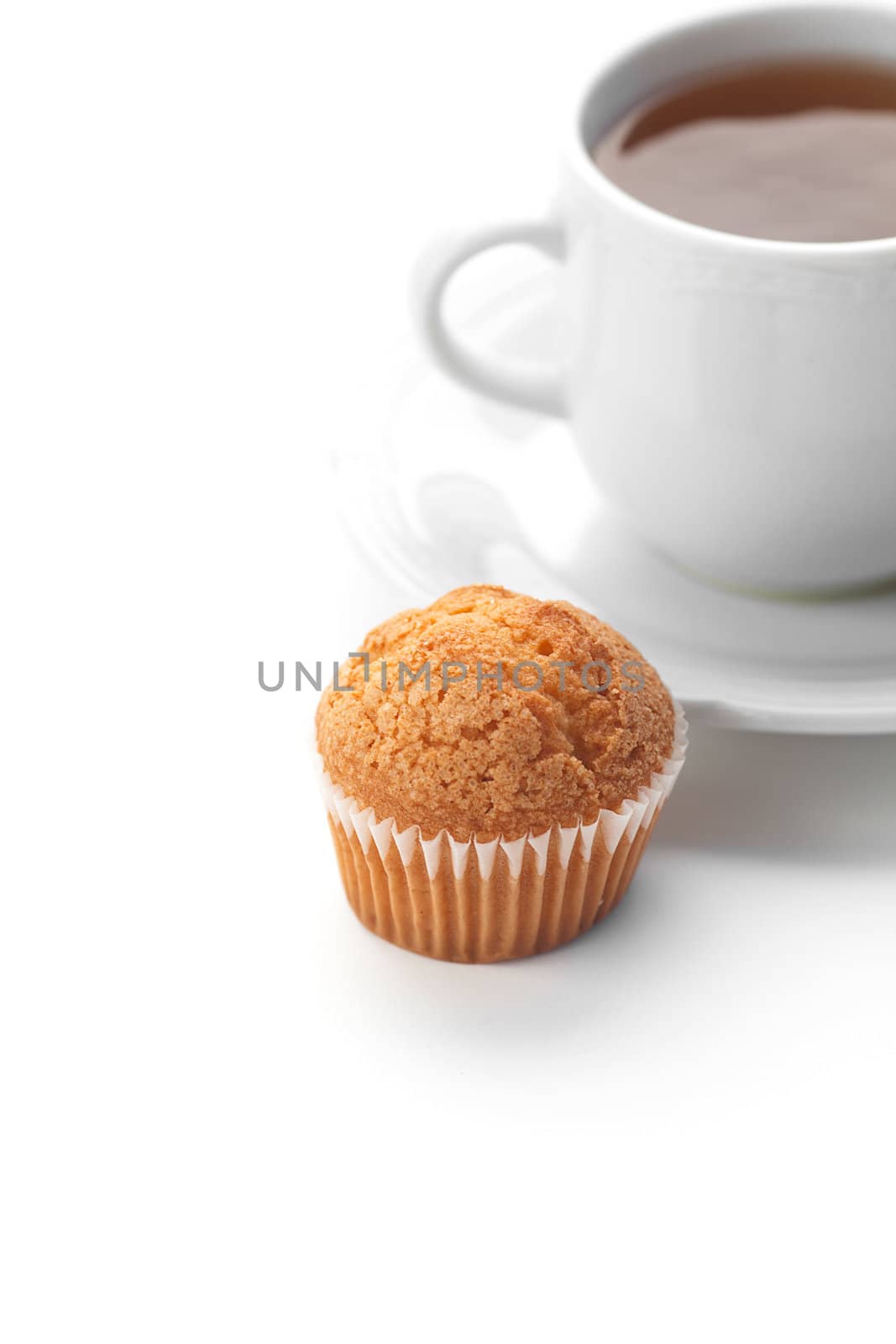 cup of tea and muffin isolated on white