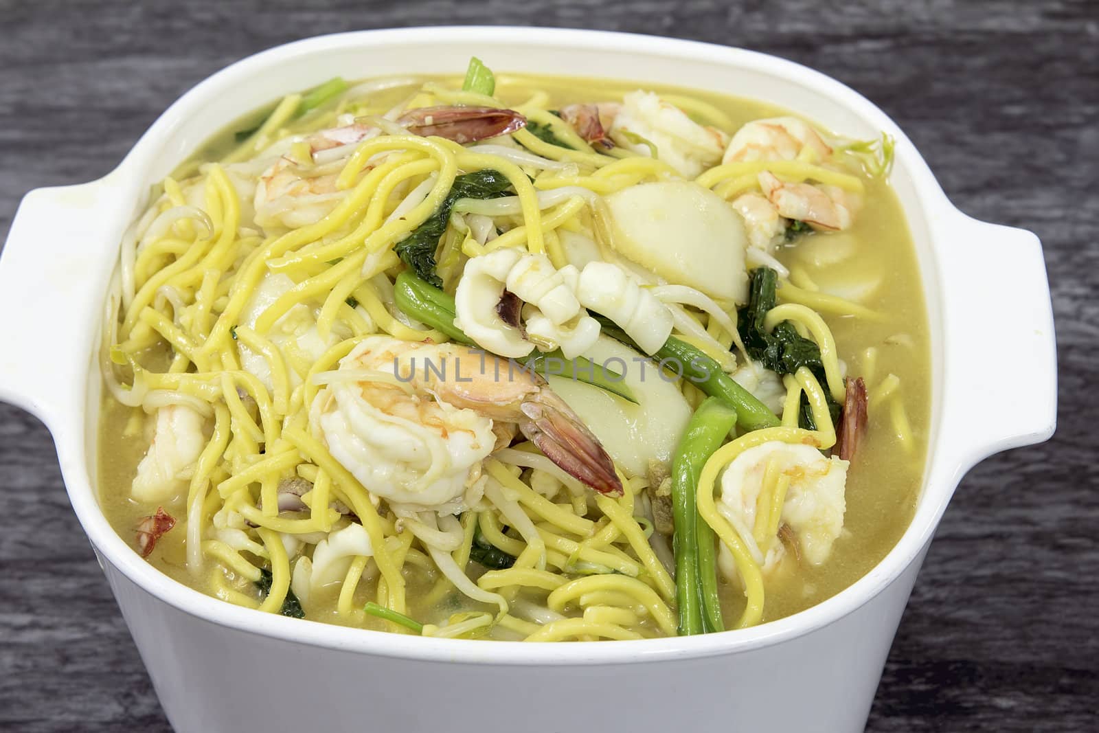 Hokkien Mee Stir Fry Yellow Noodles with Prawns Squids Fishcake and Green Vegetables