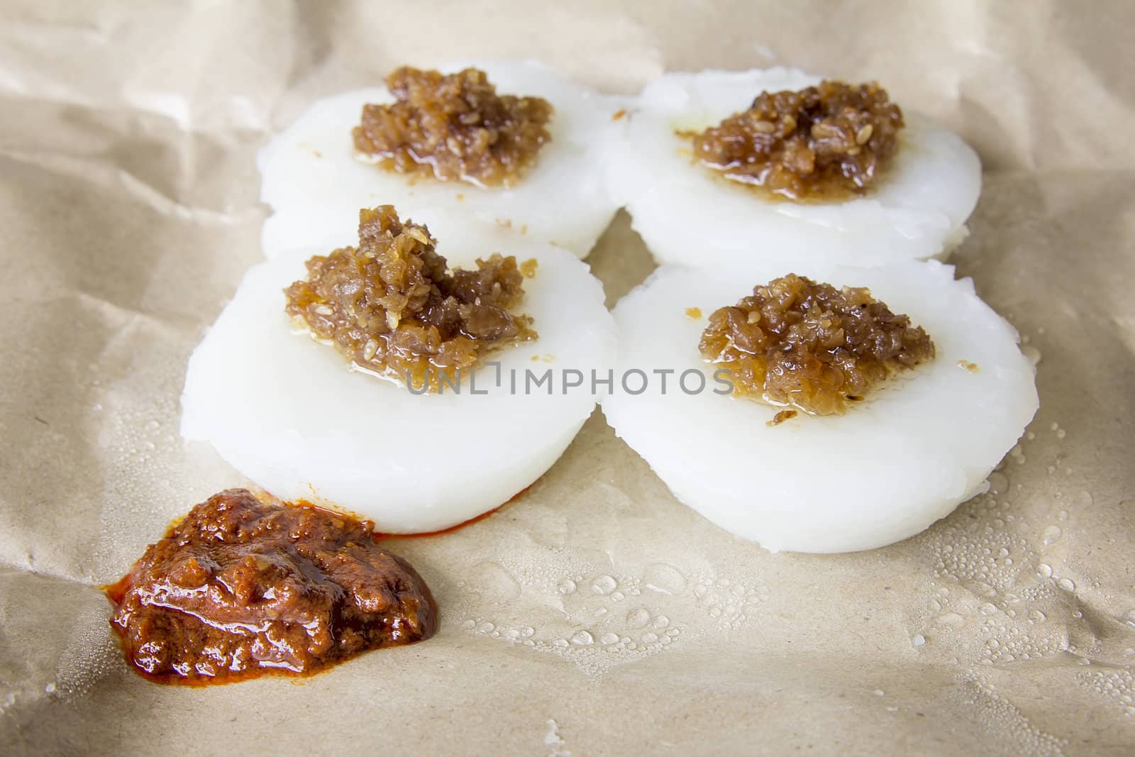 Singapore Chwee Kueh Steamed Water Rice Cake with Preserved Turnip and Chili Paste Closeup