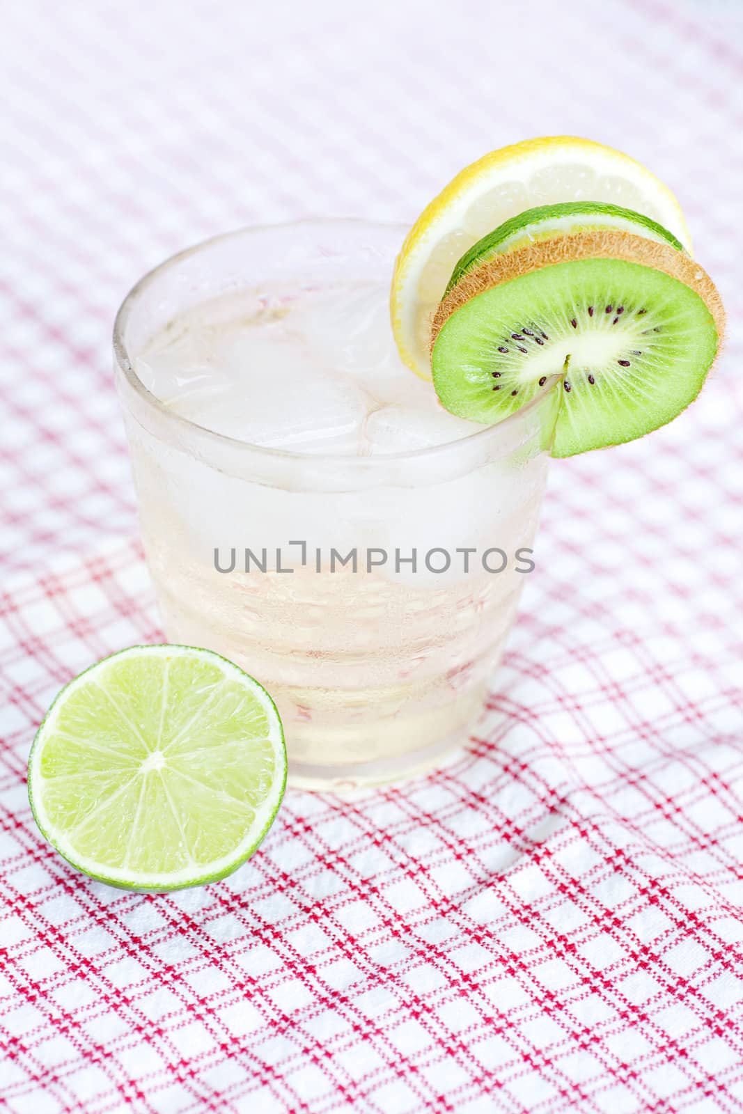 water with lemon and lime,kiwi in a glass with ice