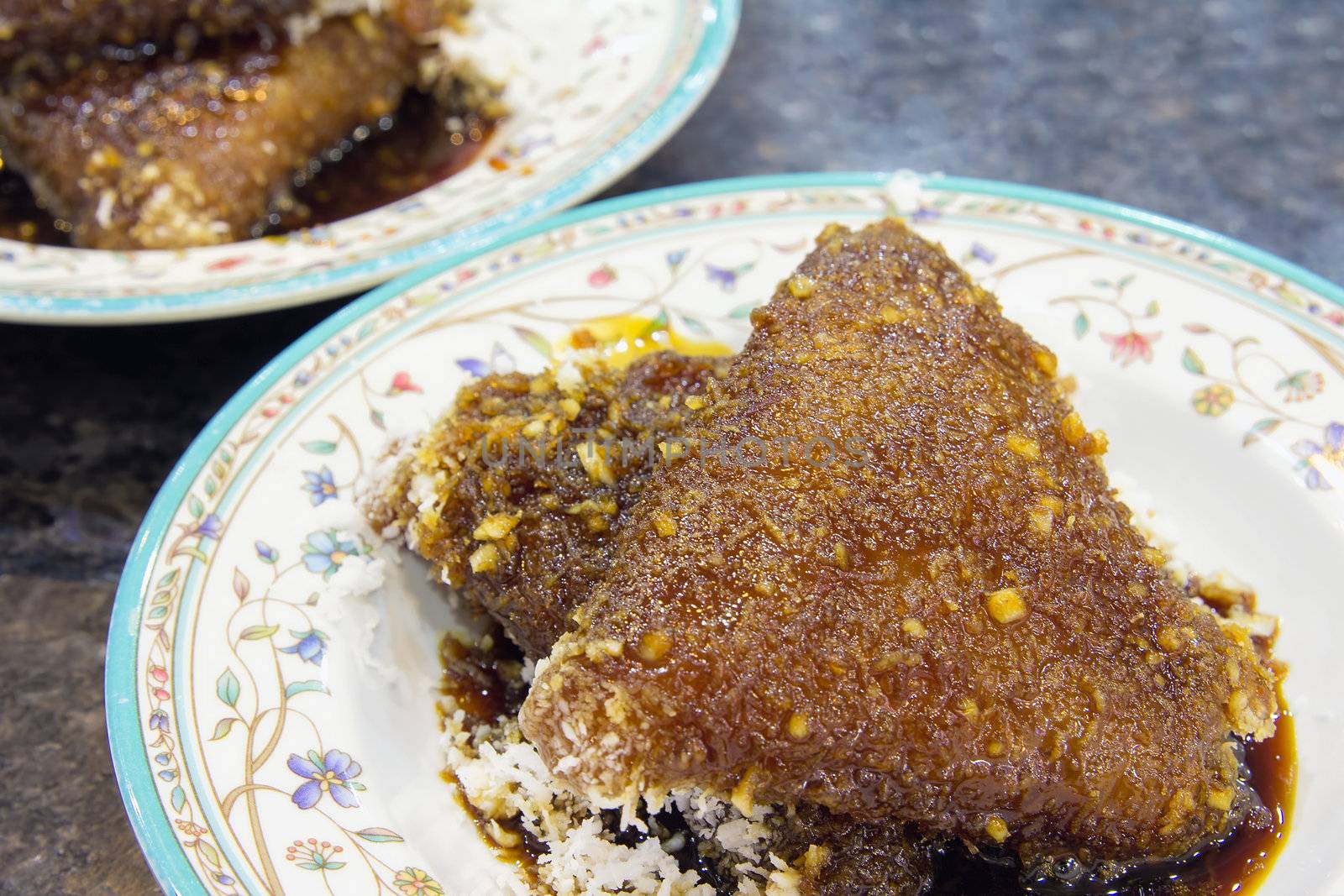 Malay Kueh Lopes Glutinous Rice with Gula Melaka Sugar Syrup and Grated Coconut Dessert Closeup