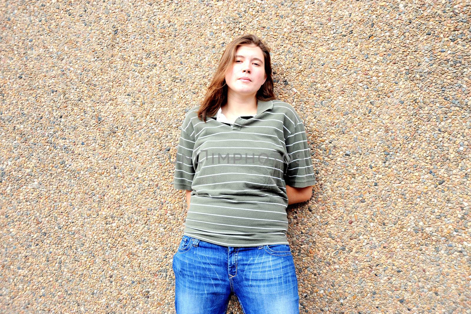 Female tomboy posing outside.