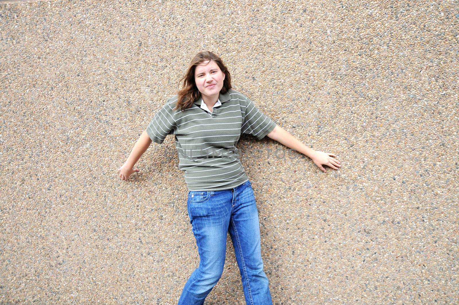 Female tomboy posing outside.