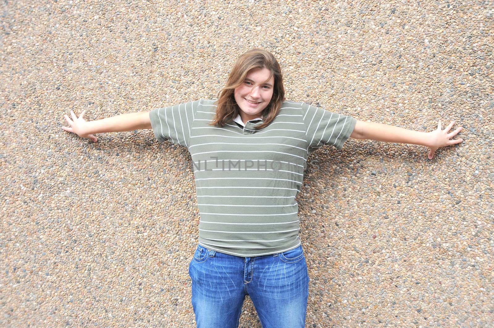 Female tomboy posing outside.