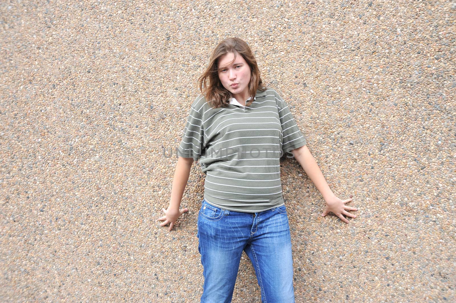 Female tomboy posing outside.