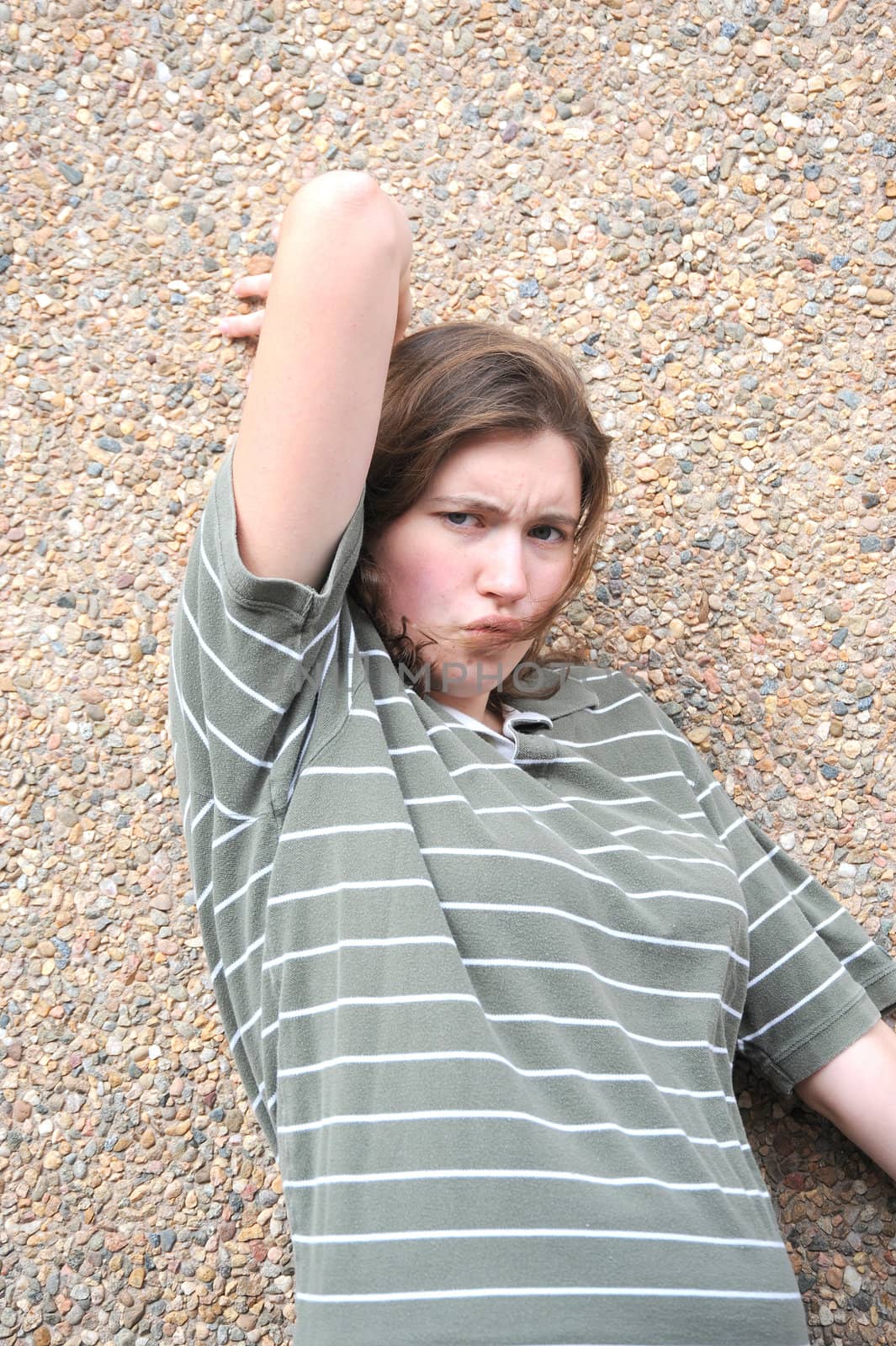 Female tomboy posing outside.