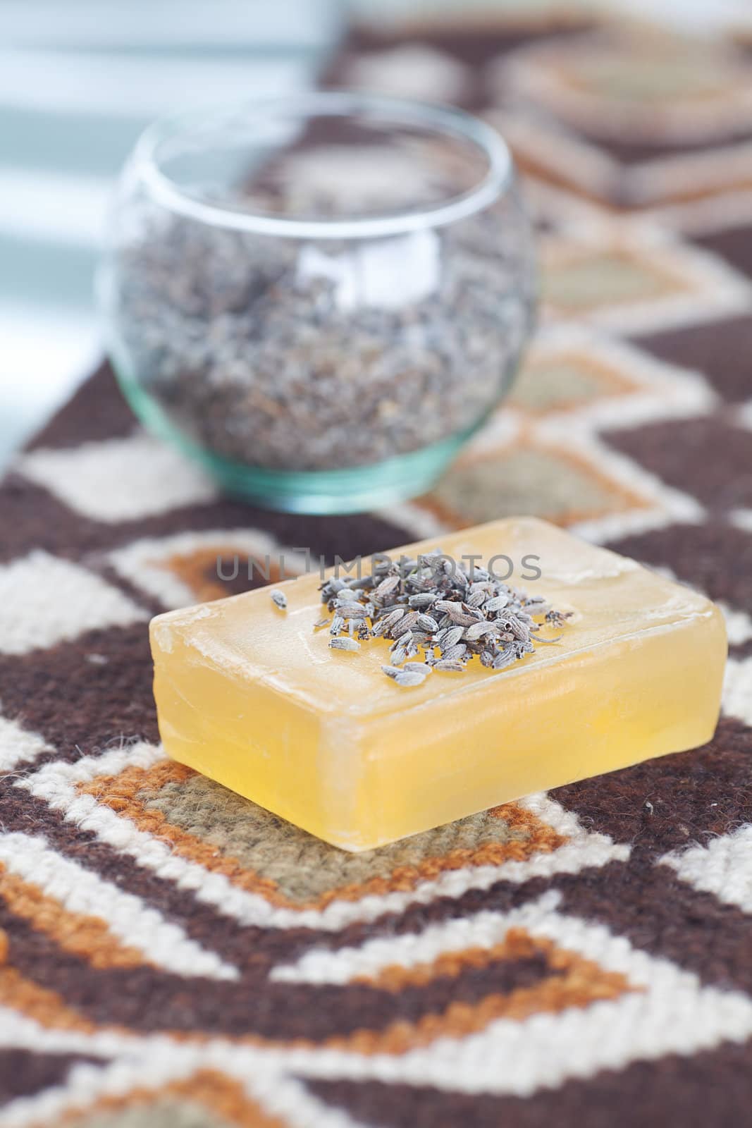 lavender in bowl and soap on ethnic mat by jannyjus