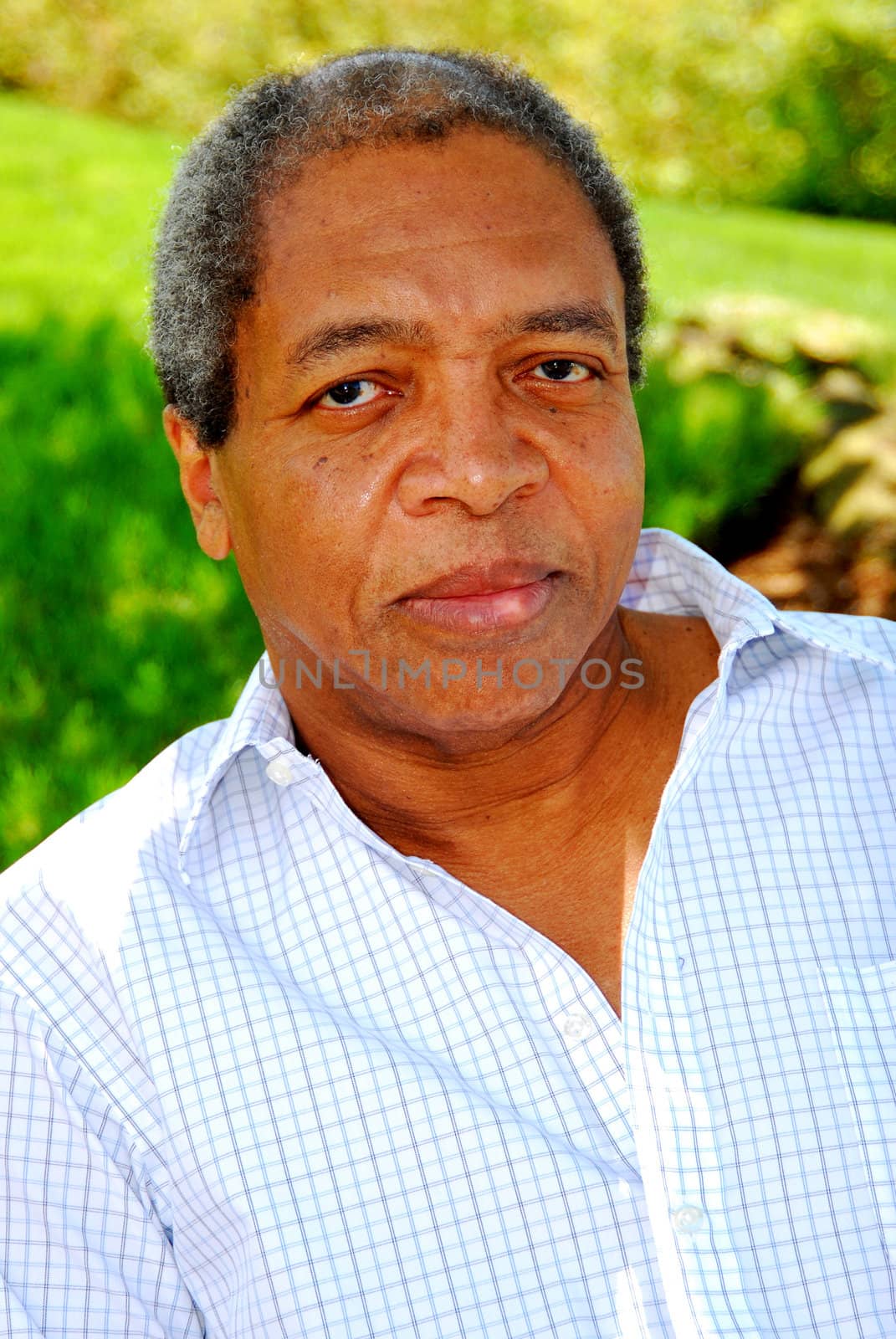 African American male posing outside.