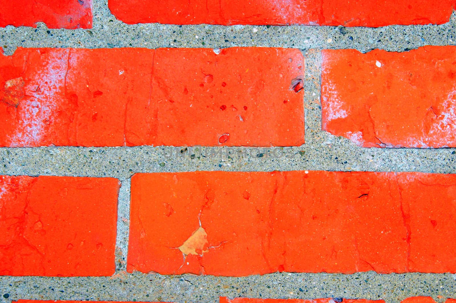 Red brick wall on a building exterior.