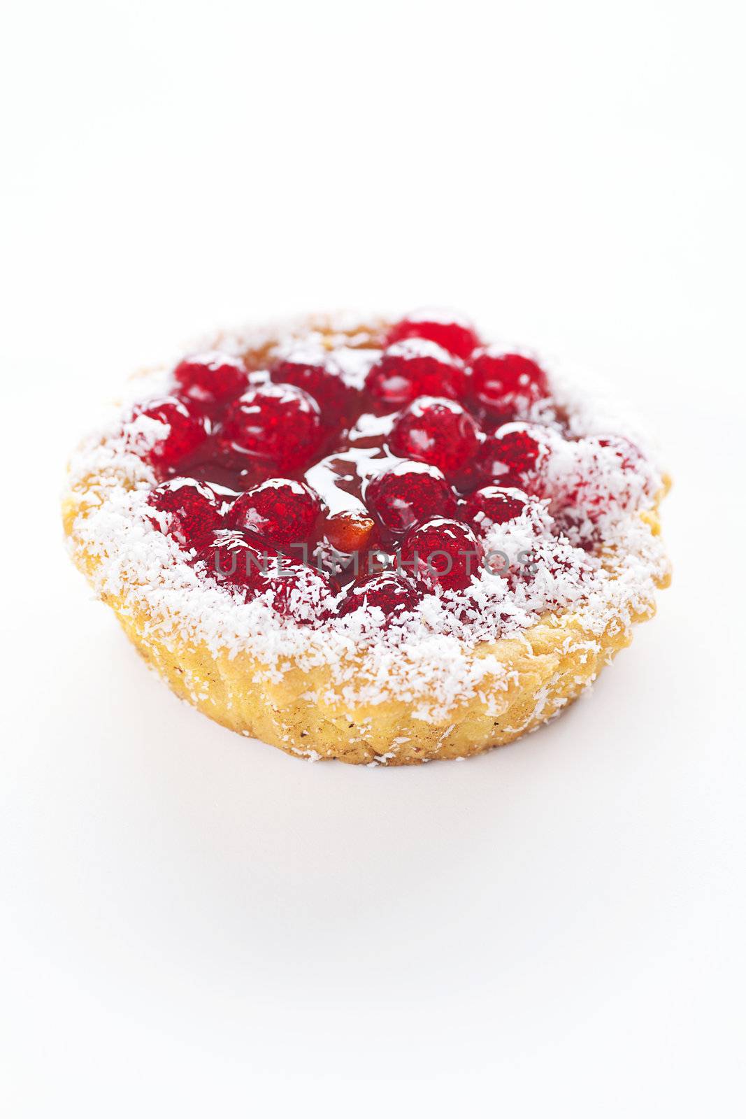 beautiful cake with berries on a white background