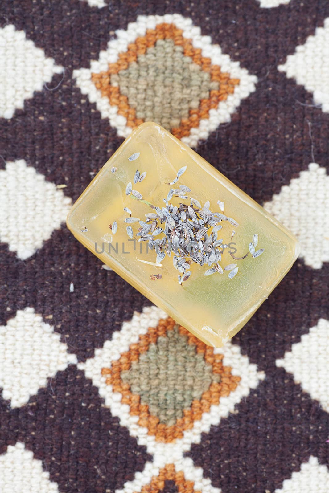 lavender and soap on ethnic mat