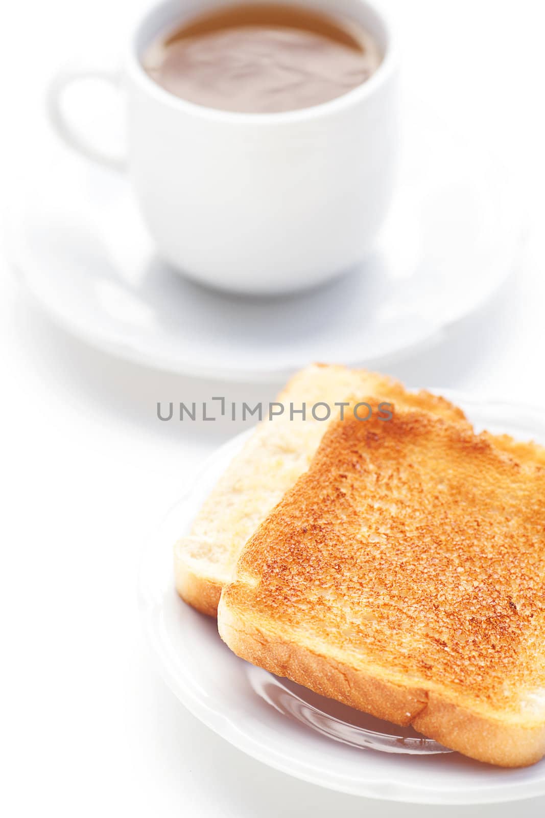 cup of tea and toast isolated on white