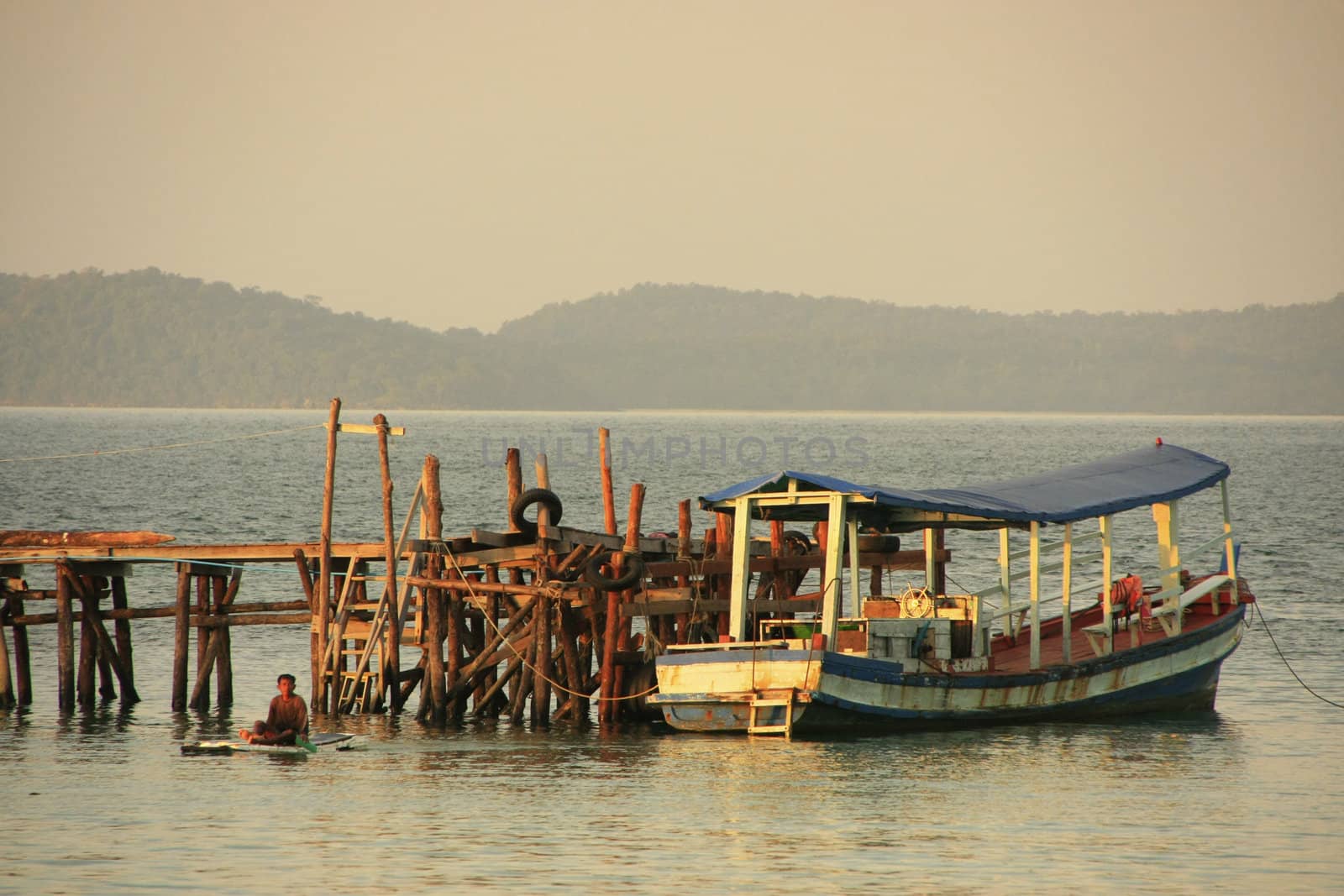 Wooden jetty and fishing boat, Koh Rong Samlon island, Cambodia, Southeast Asia