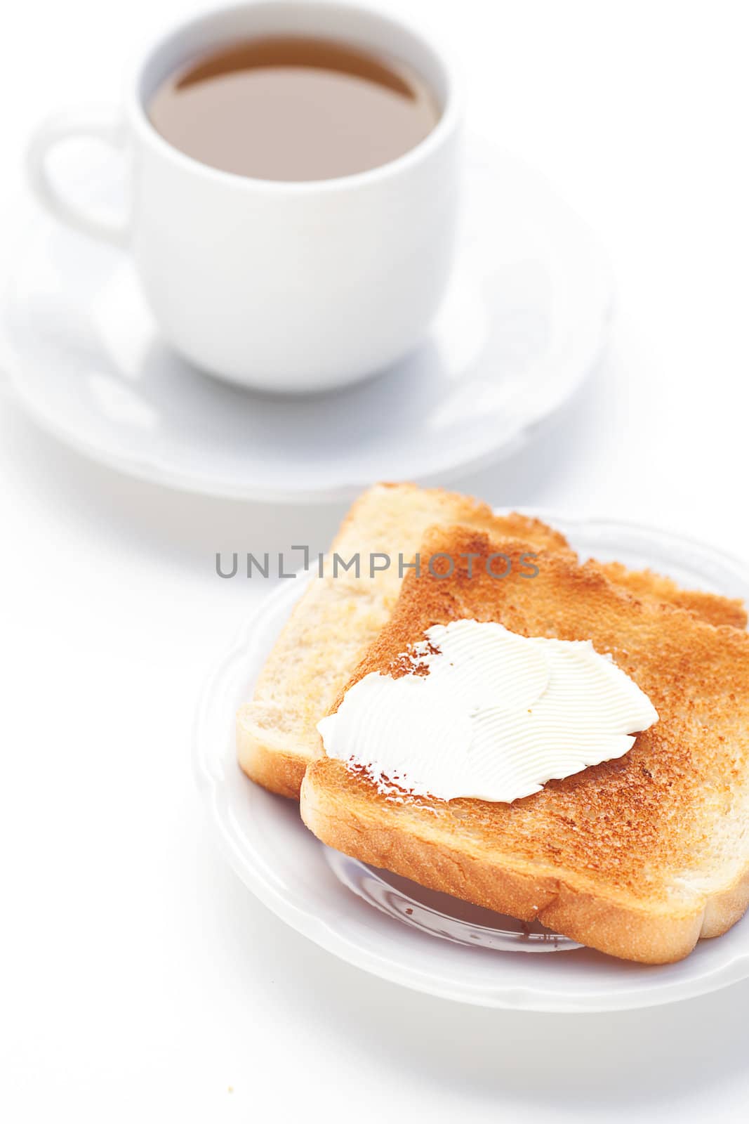 tea and toast with butter isolated on white by jannyjus