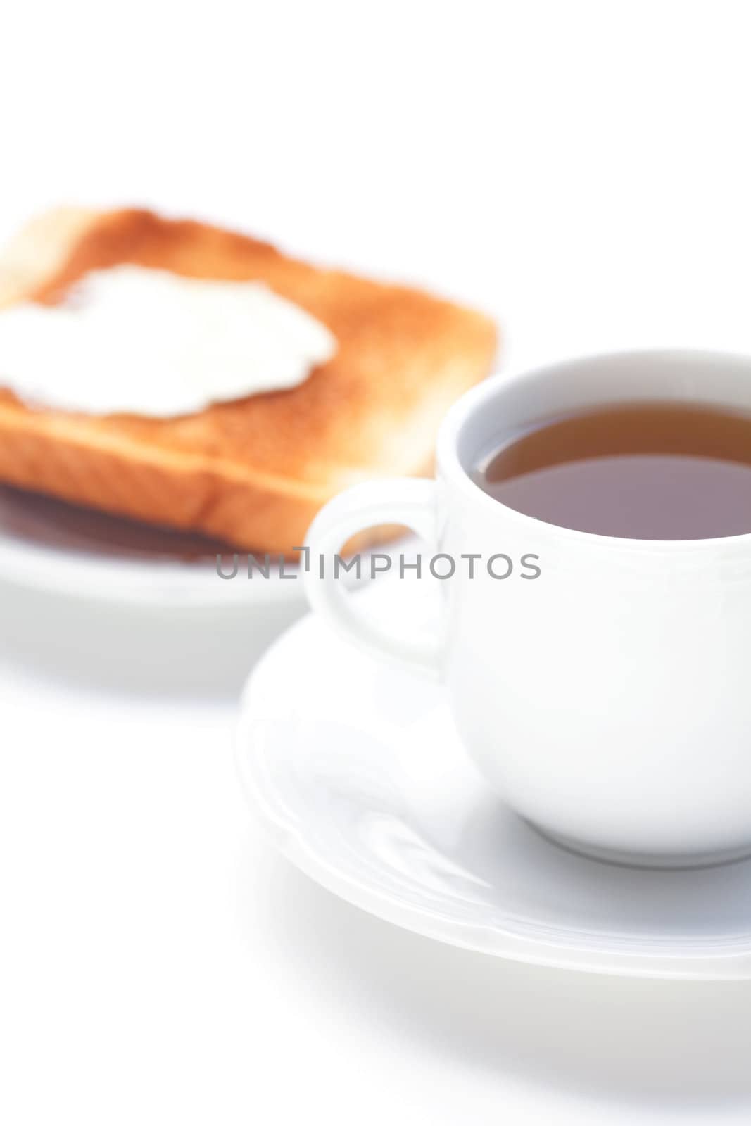 tea and toast with butter isolated on white by jannyjus