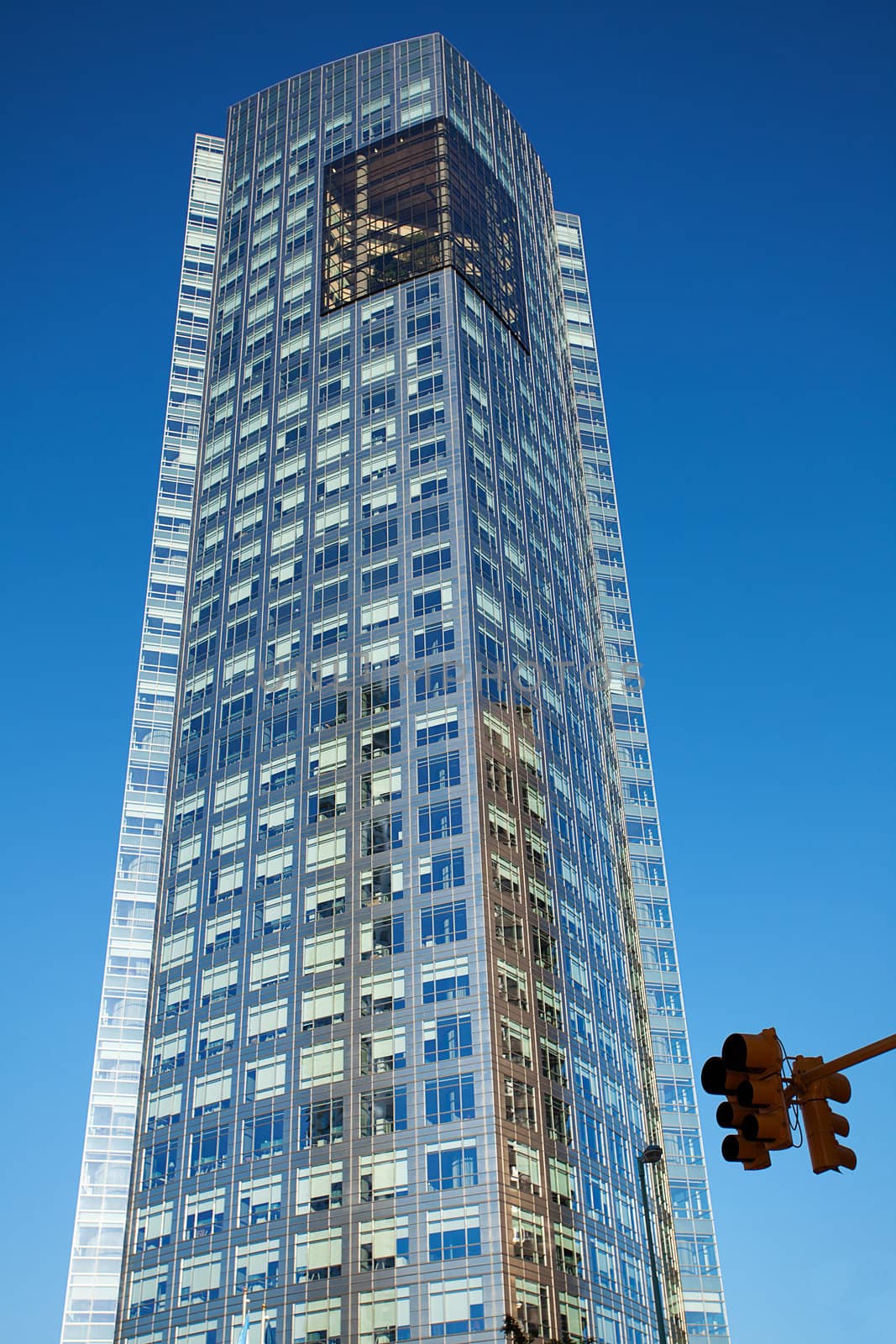 Beautiful modern office building against the blue sky by jannyjus