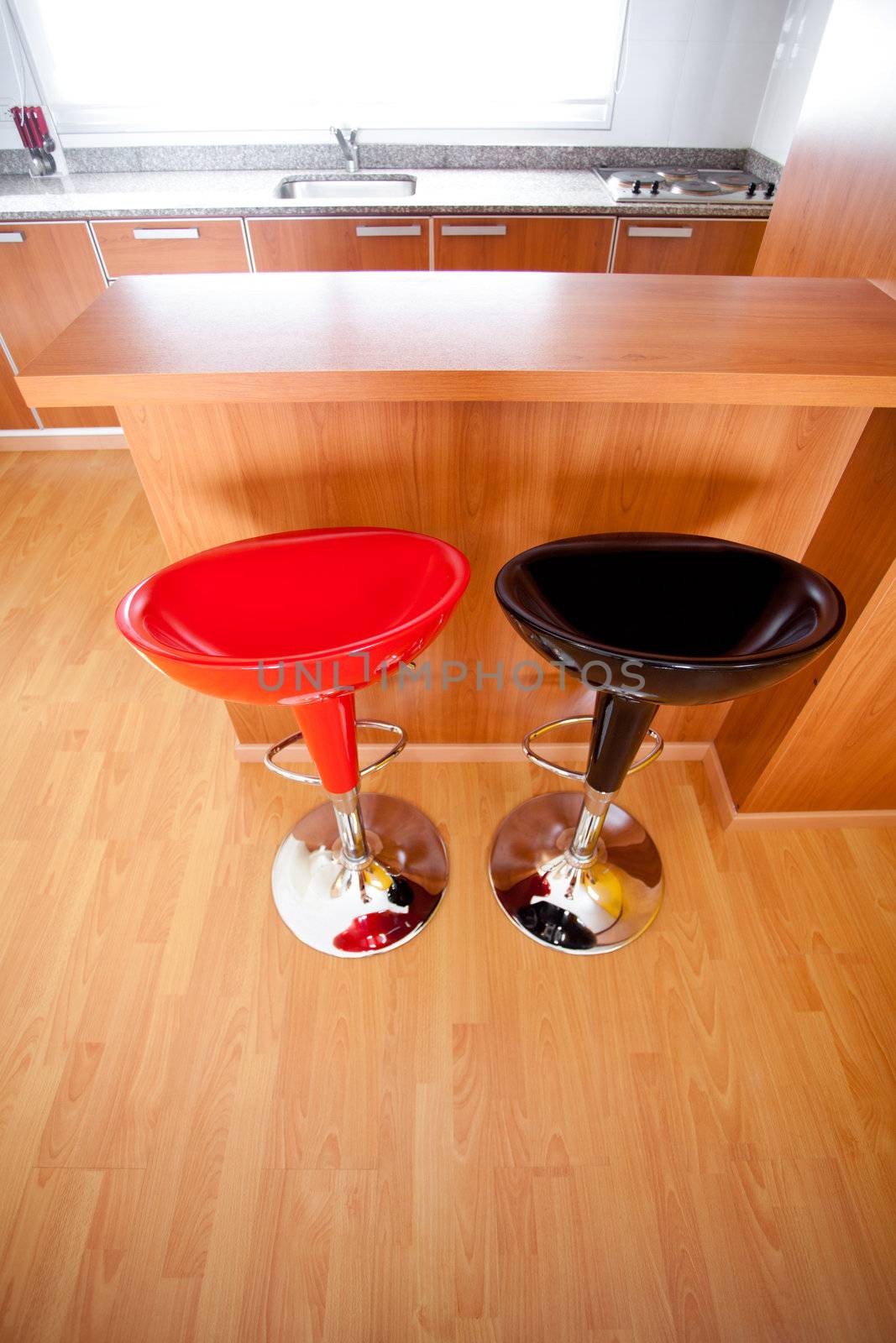 kitchen interior with bar chairs in the apartment by jannyjus