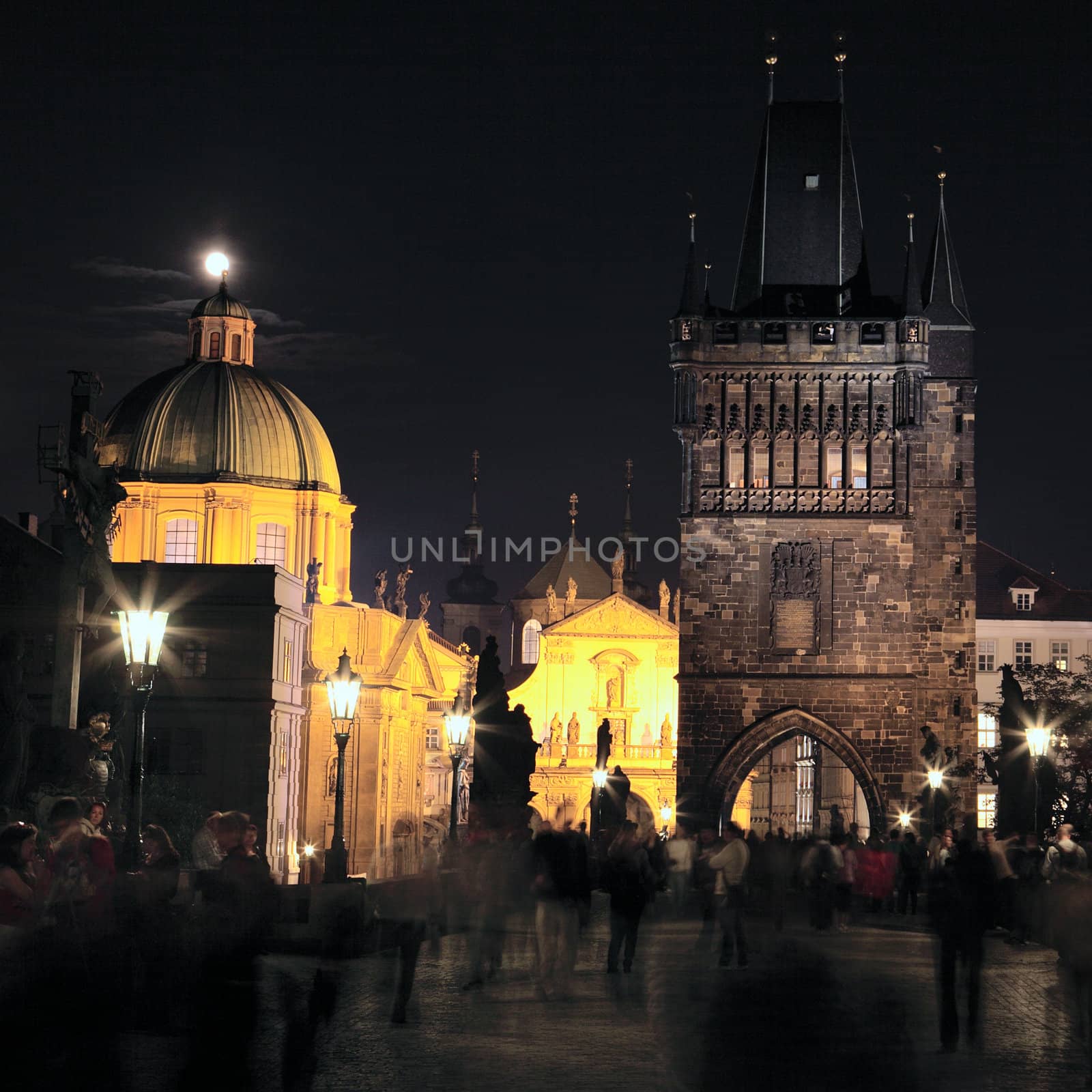 view of Prague by night on a bridge