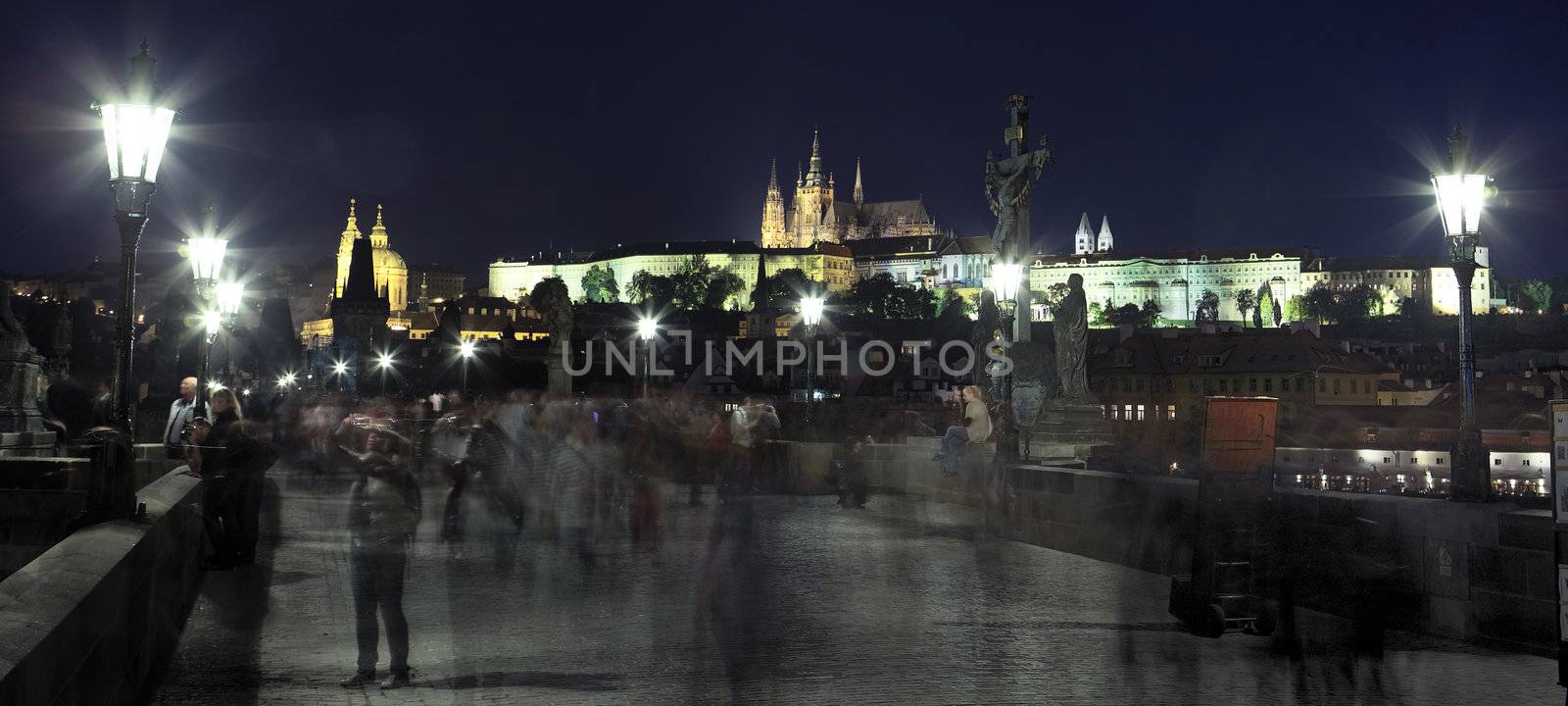 panoramic view of famous bridge in Prague by night