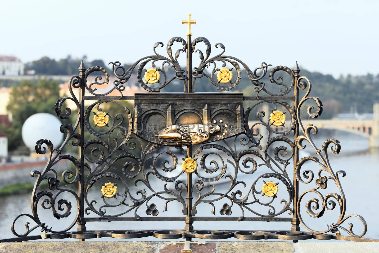 Iron forged grid with St. John Nepomuk carving, Charles bridge, Prague 
