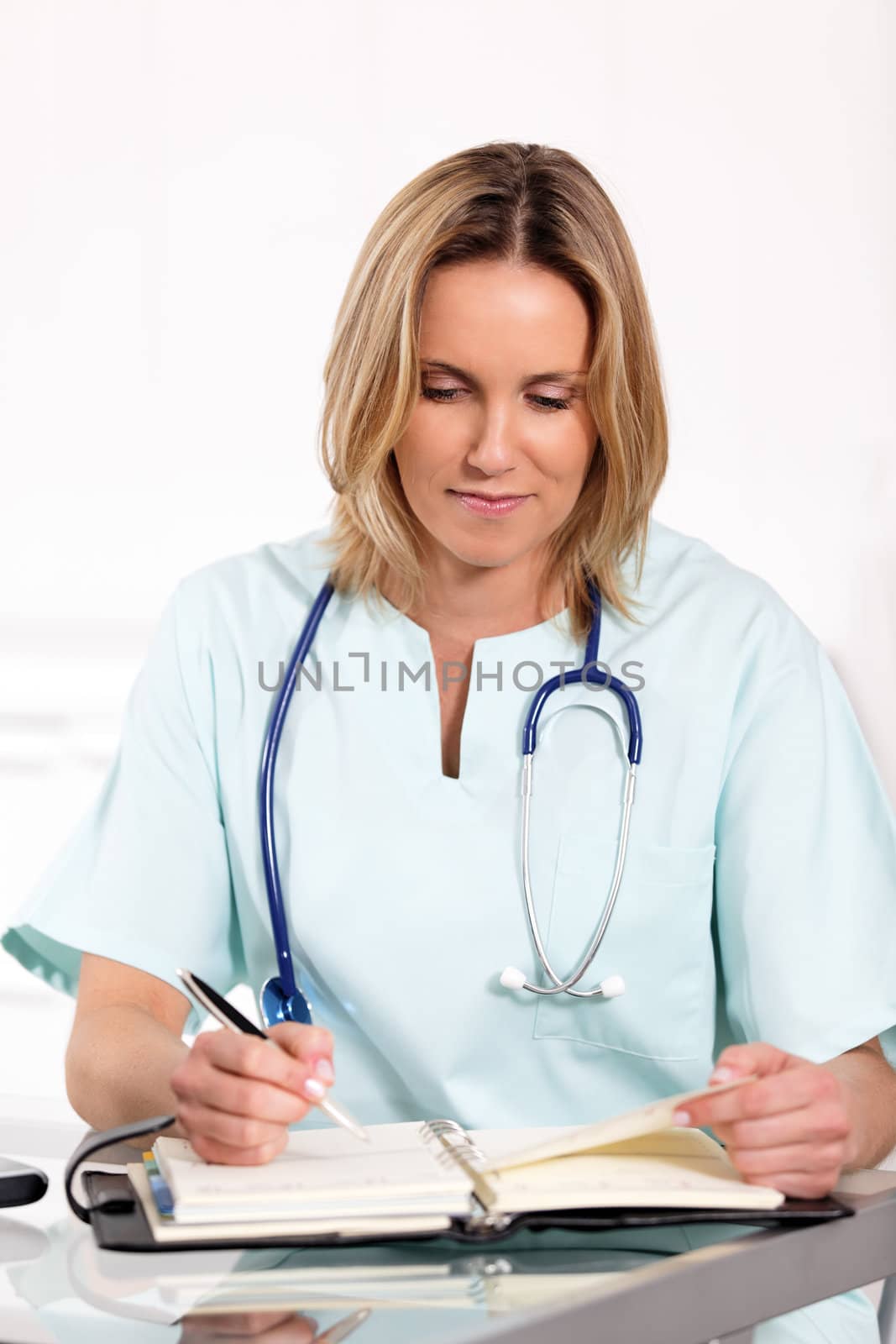 portrait of blond woman doctor in hospital