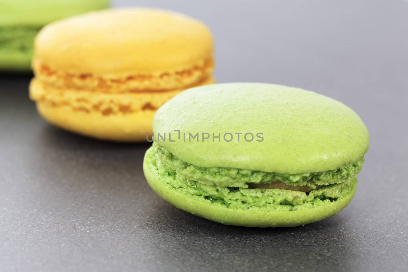 two green and yellow macaroons in kitchen