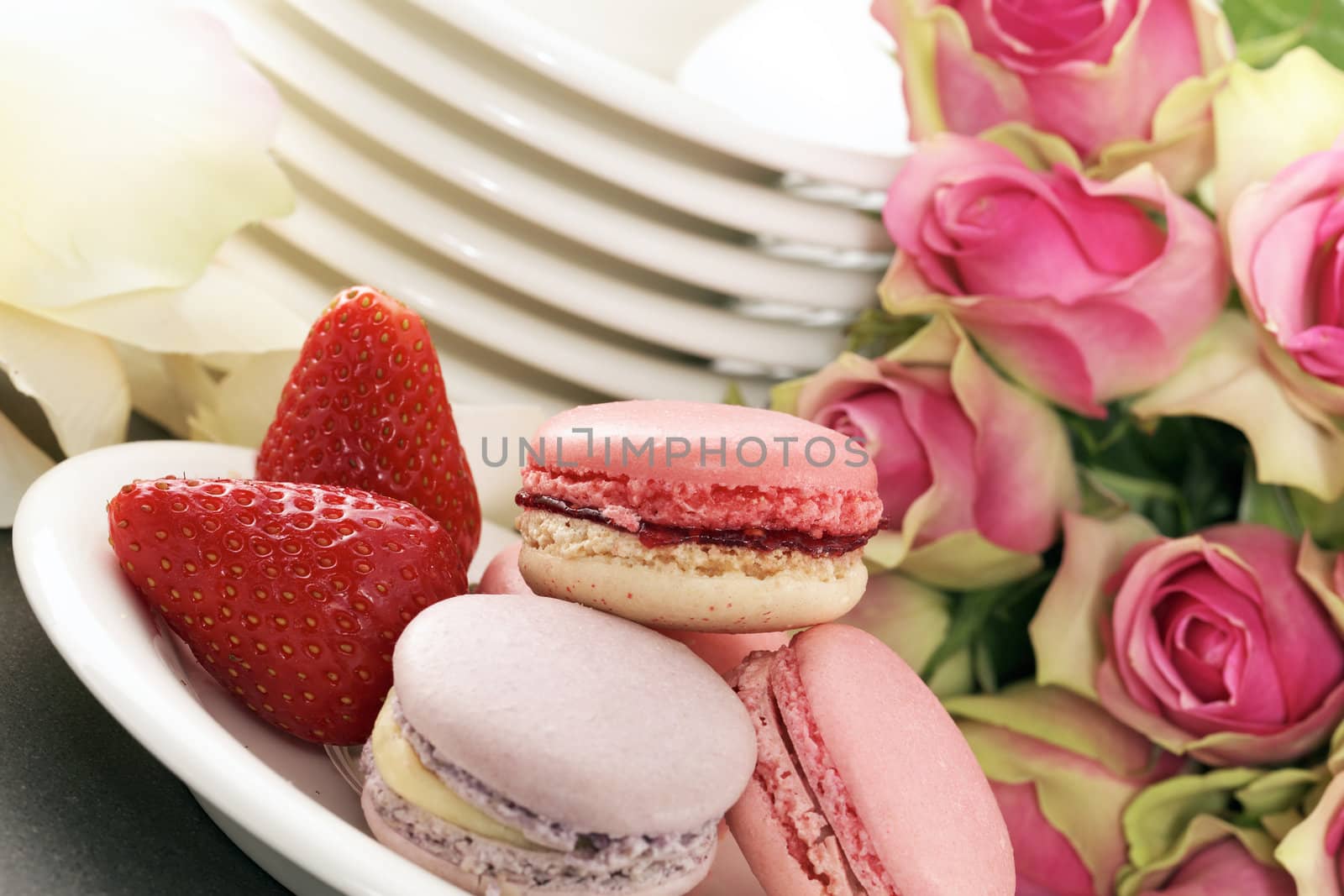 pink wedding dessert with macaroons and roses