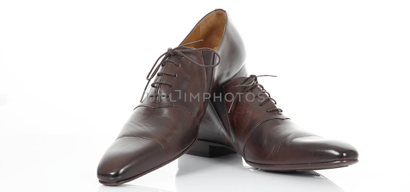 Brown shoes isolated on the white, panoramic view