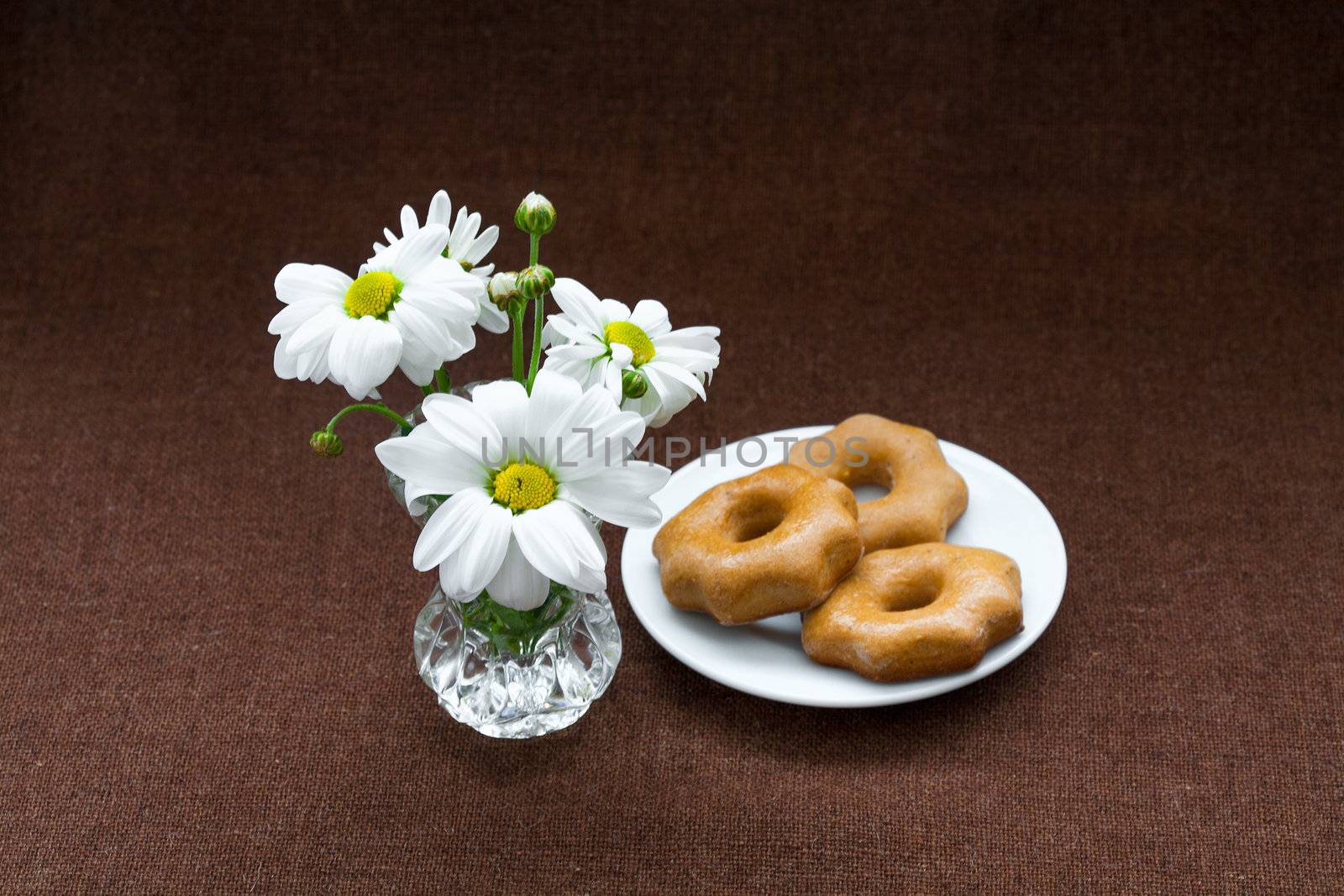 cookies in a plate on a background of burlap by sfinks