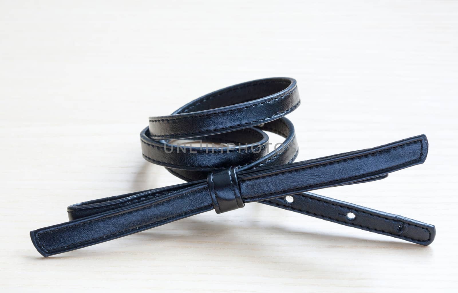 object on wooden background - waist-belt close up