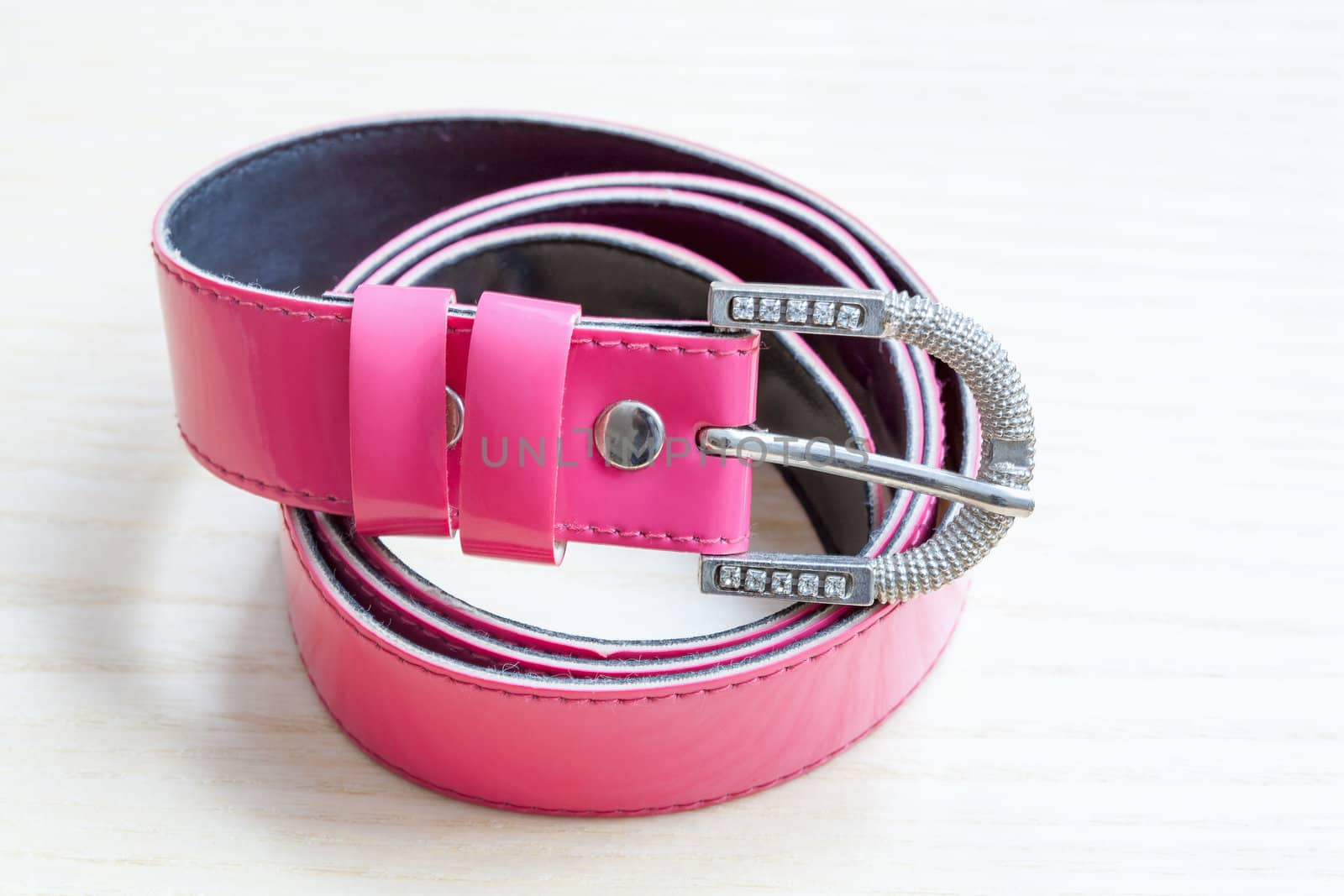 pink women style belt on wooden background