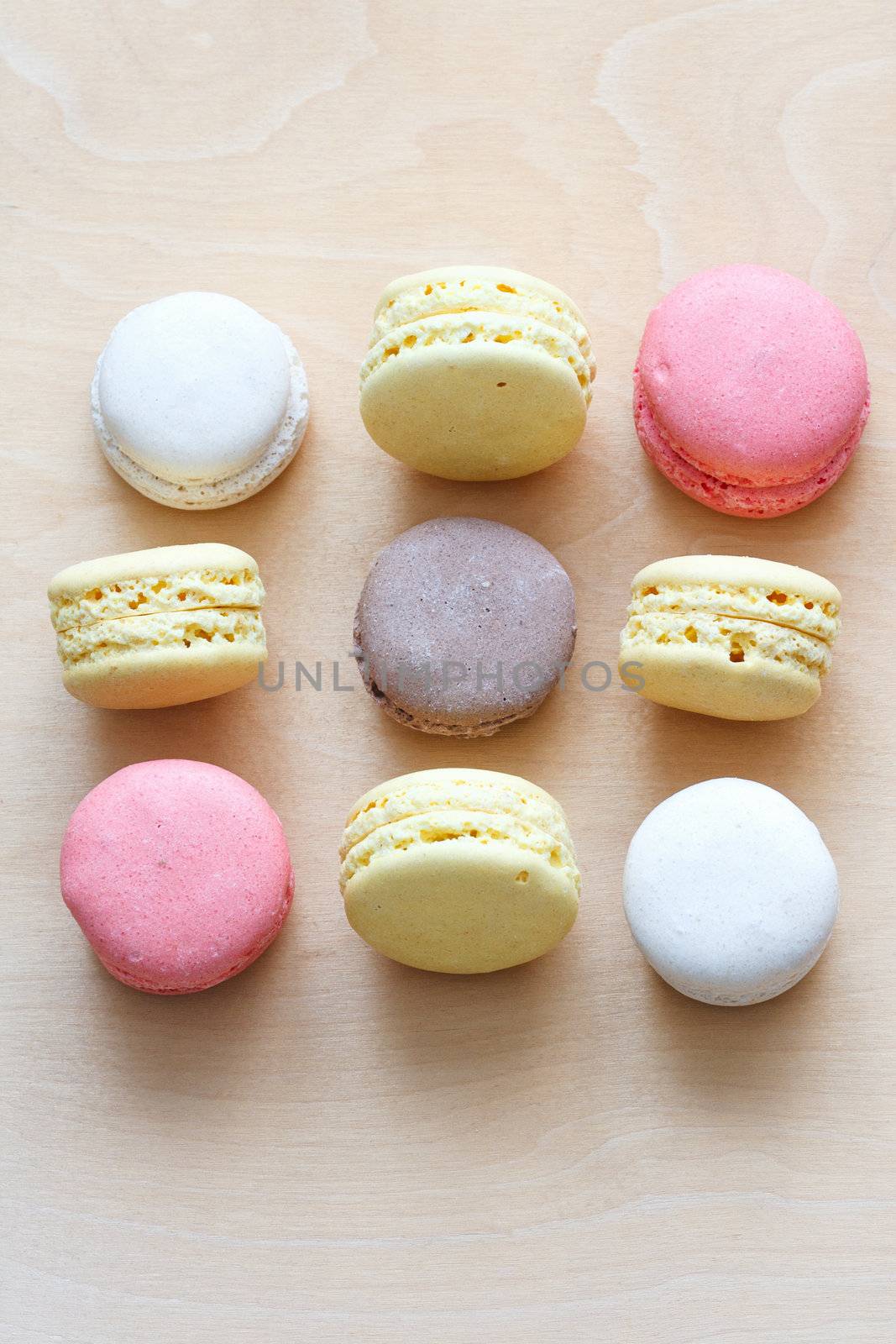 colored macaron on wooden background