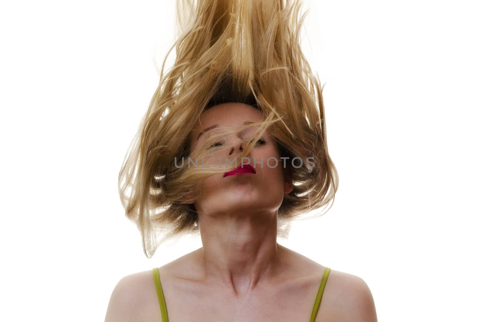 portrait of a woman with hair flying in the air on white background