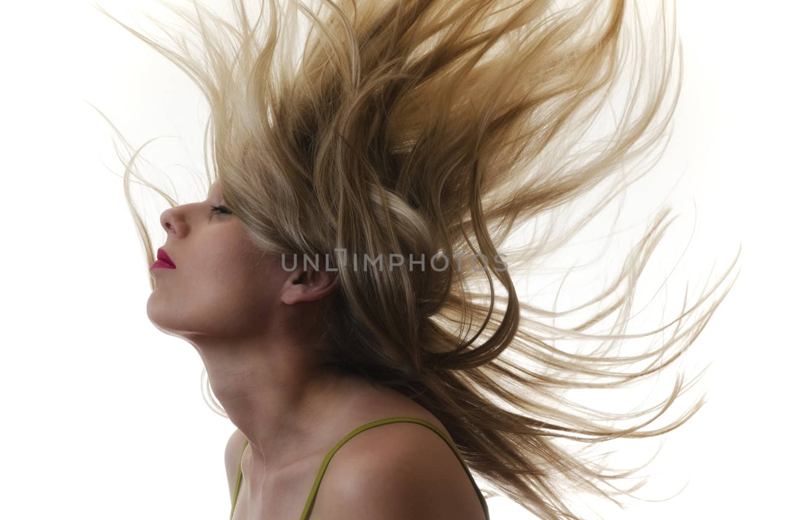 portrait of a woman with hair flying in the air on white background